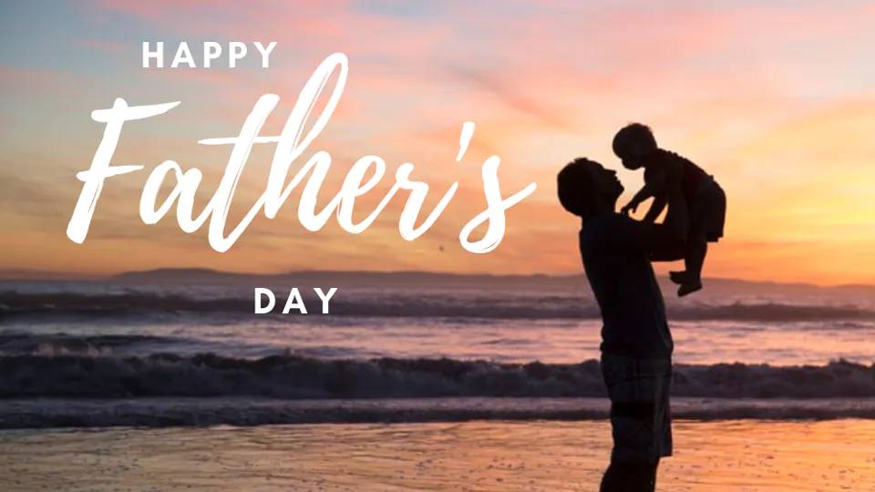 Silhouette of father lifting child on beach at sunset with Happy Father's Day text