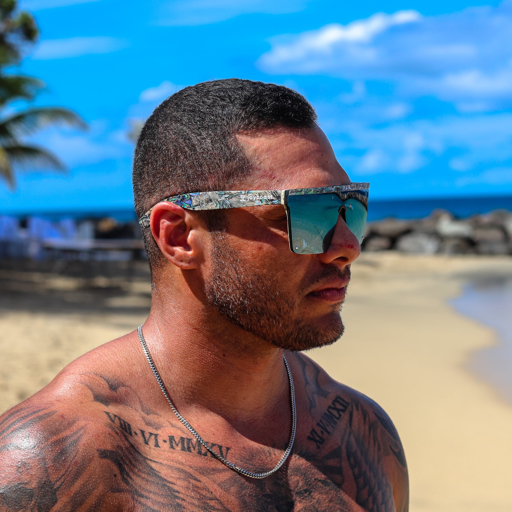 Frameless wooden sunglasses with teal mirrored lenses