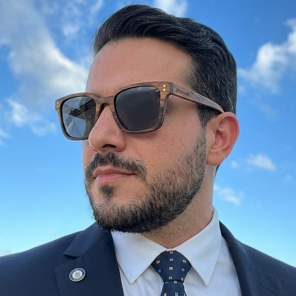 Wooden sunglasses on face, brown frame with dark lenses and black side arms