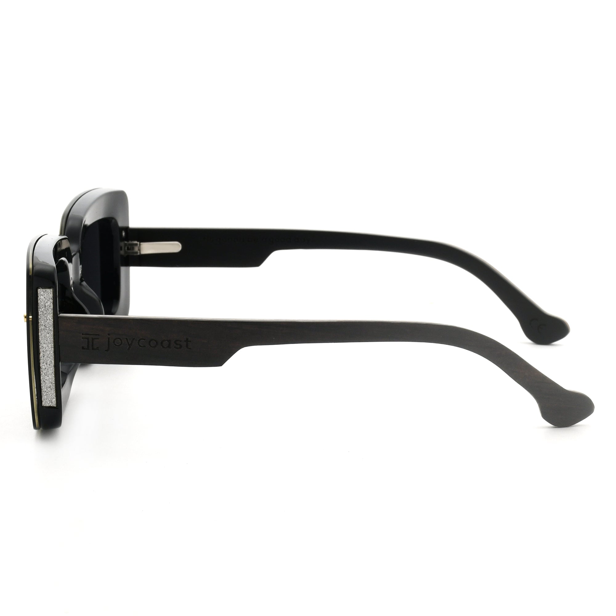 Joycoast black wooden square sunglasses with dark lenses, viewed from a top-down perspective on a white background.