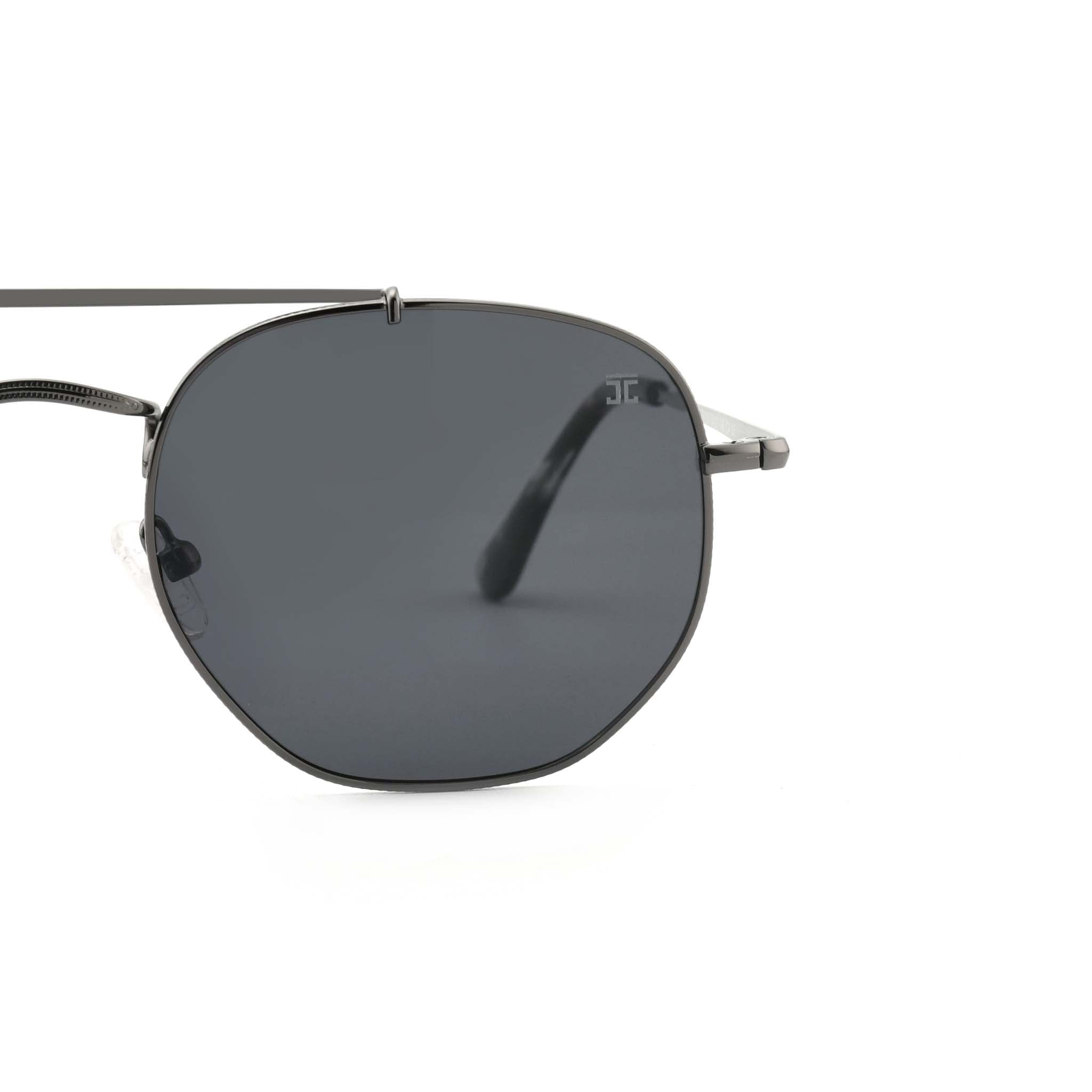 Partial view of Joycoast Skyline black metal sunglasses showing the dark lens and a tortoise shell arm.