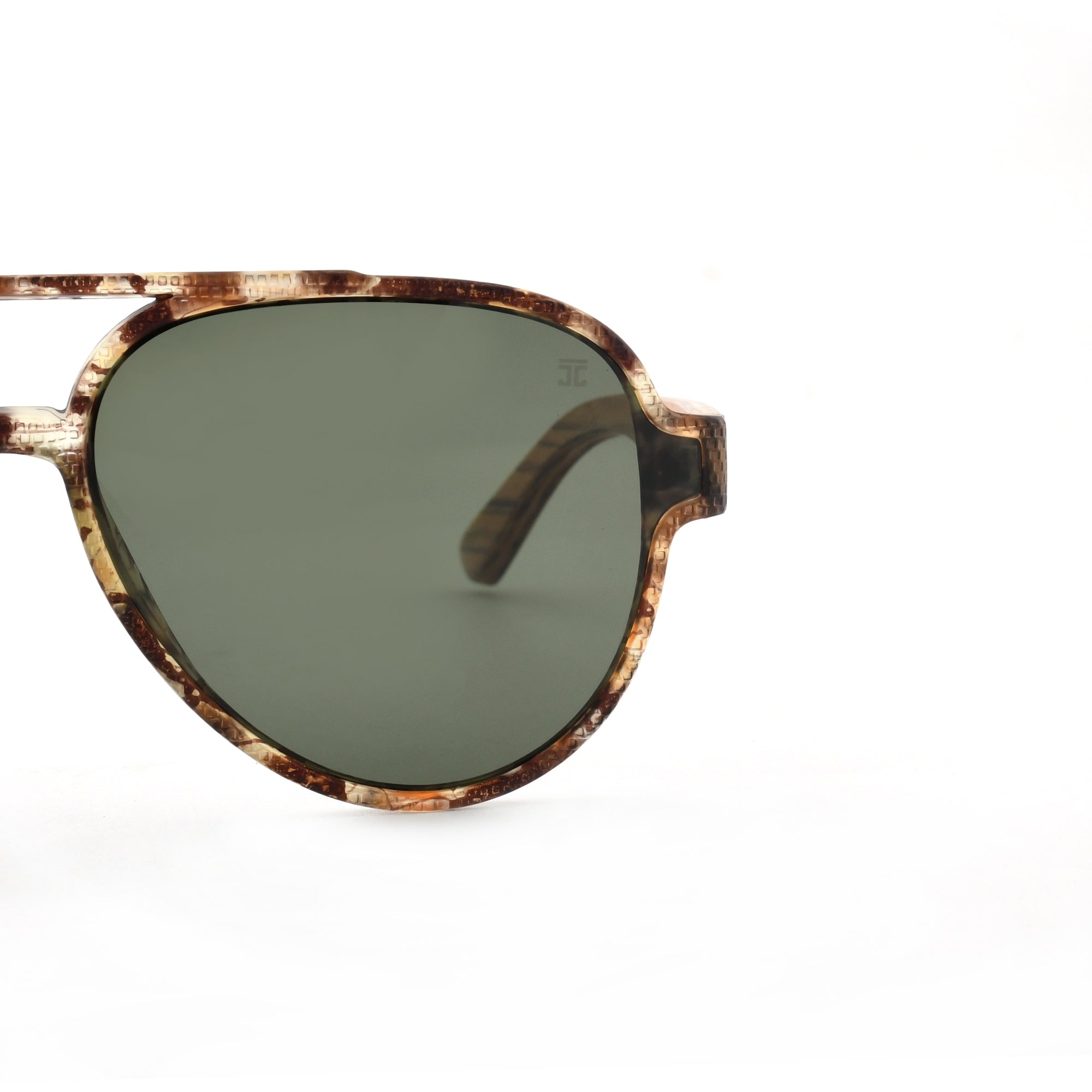 Partial view of Joycoast tortoise shell wooden sunglasses with dark green lenses and a full wooden frame.