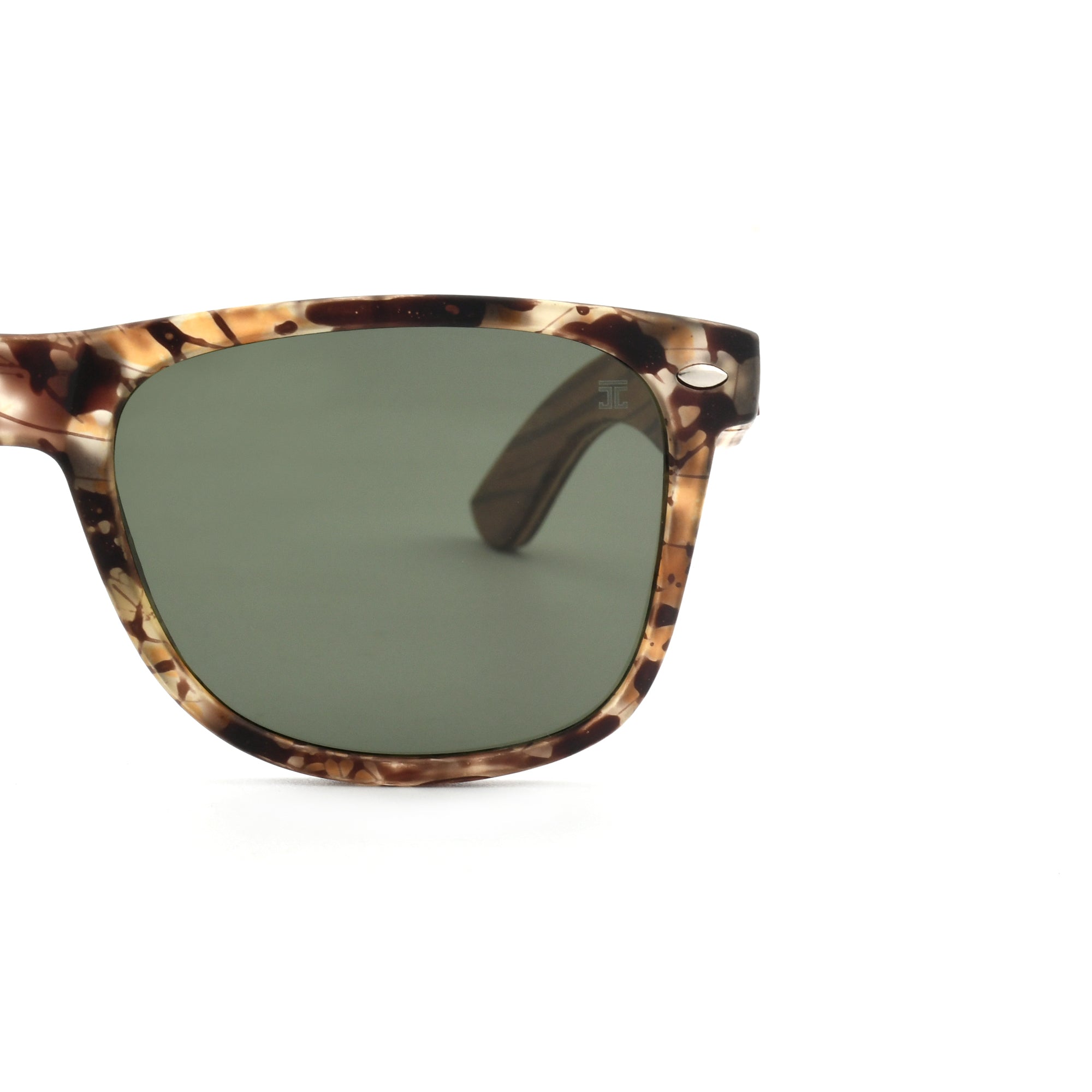 Partial view of Joycoast tortoise shell wooden sunglasses with dark green lenses and a wooden frame.