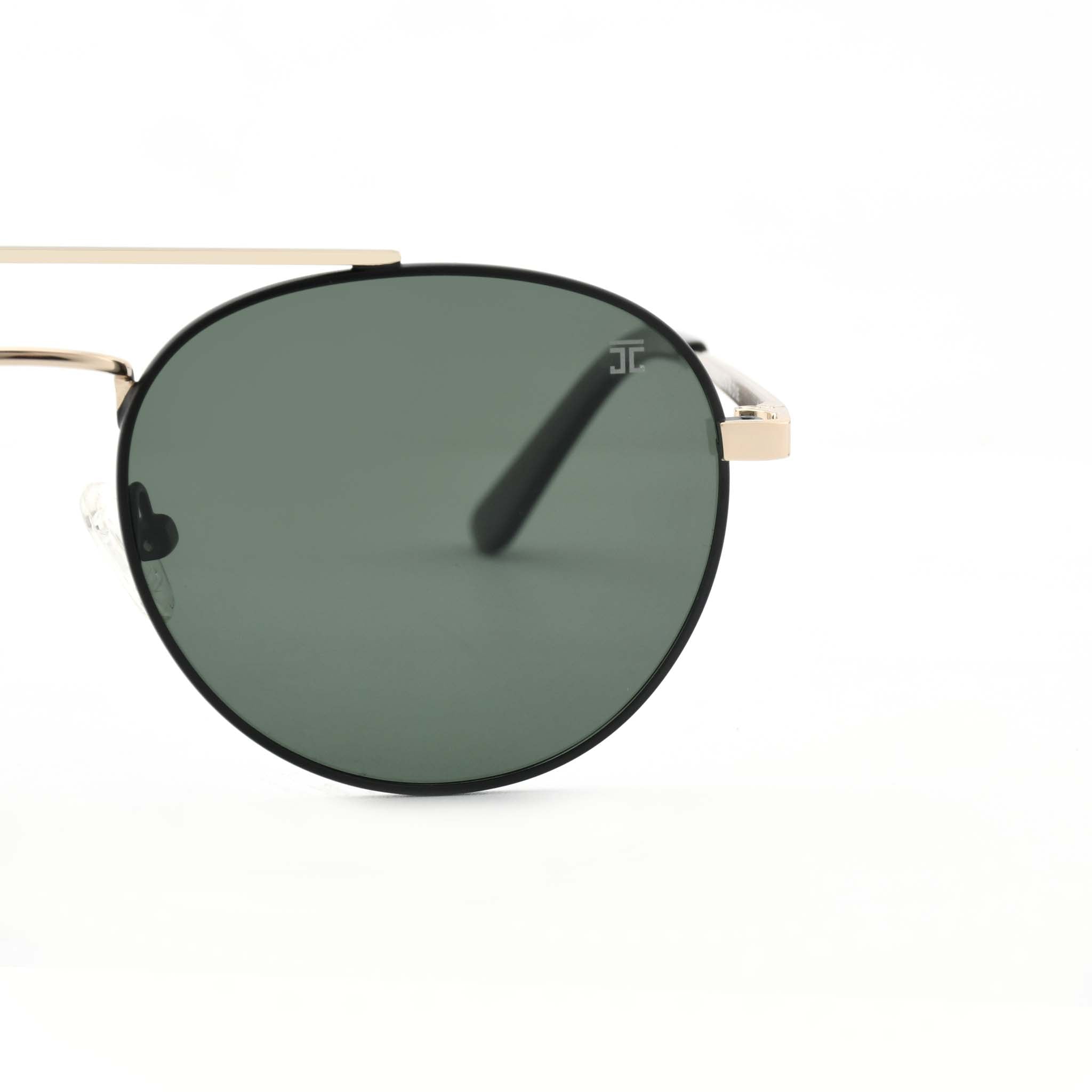 Partial view of Joycoast Willow round sunglasses with a gold metal frame and a dark green lens.