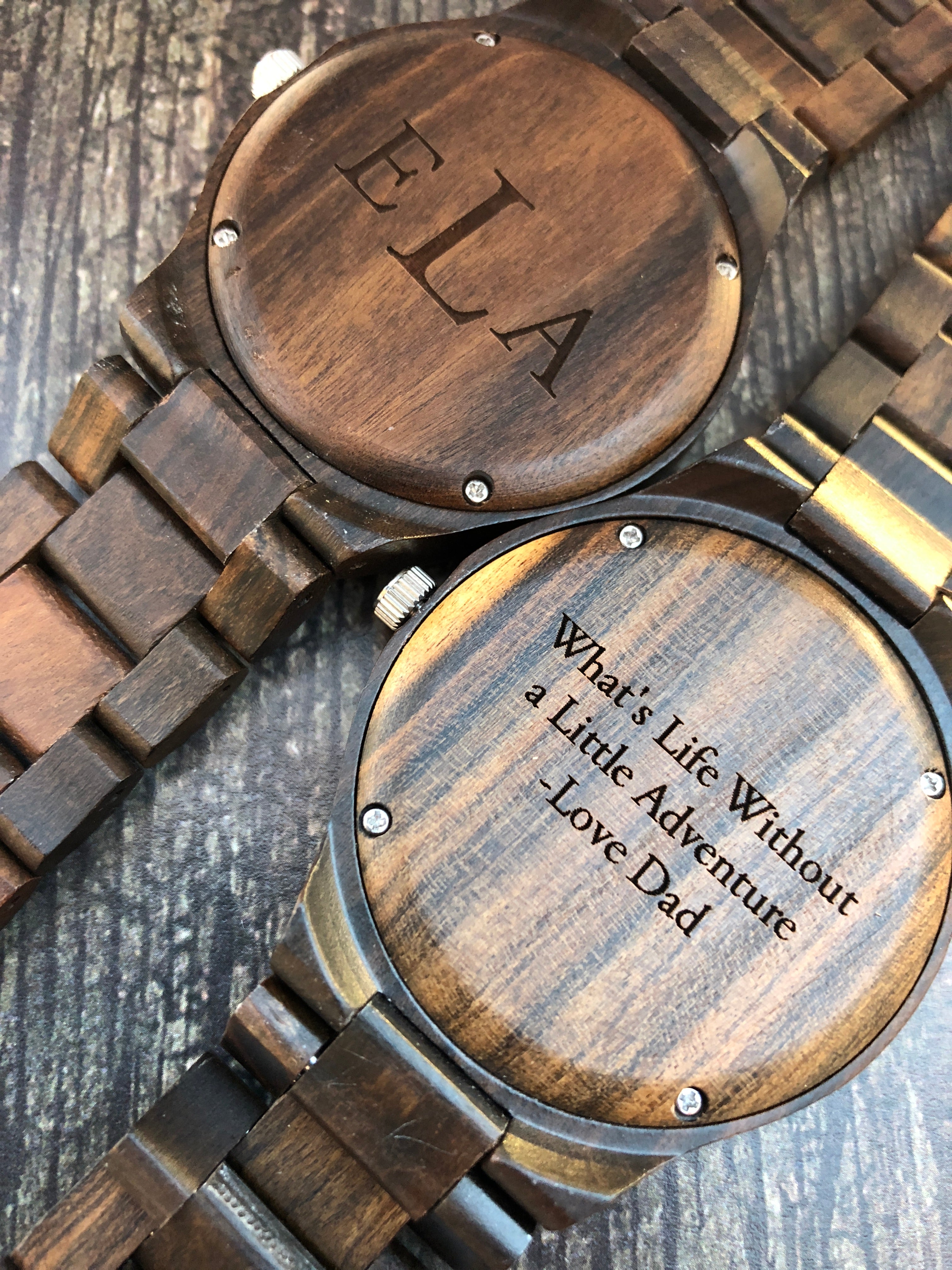 A personalized wooden watch engraved for Father's Day, showcasing a classic design with a leather strap and wooden face.