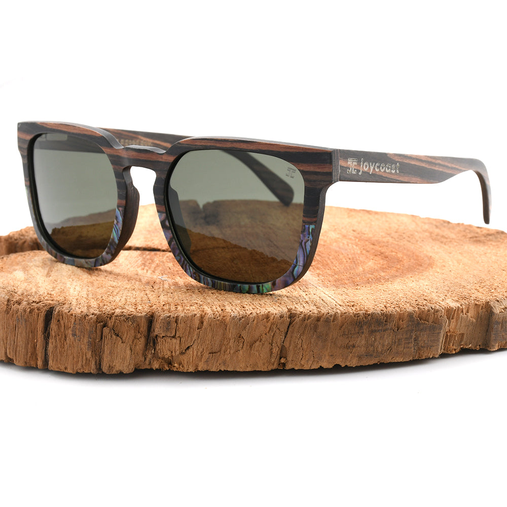 Wooden sunglasses with dark patterned frame and amber-brown tinted lenses