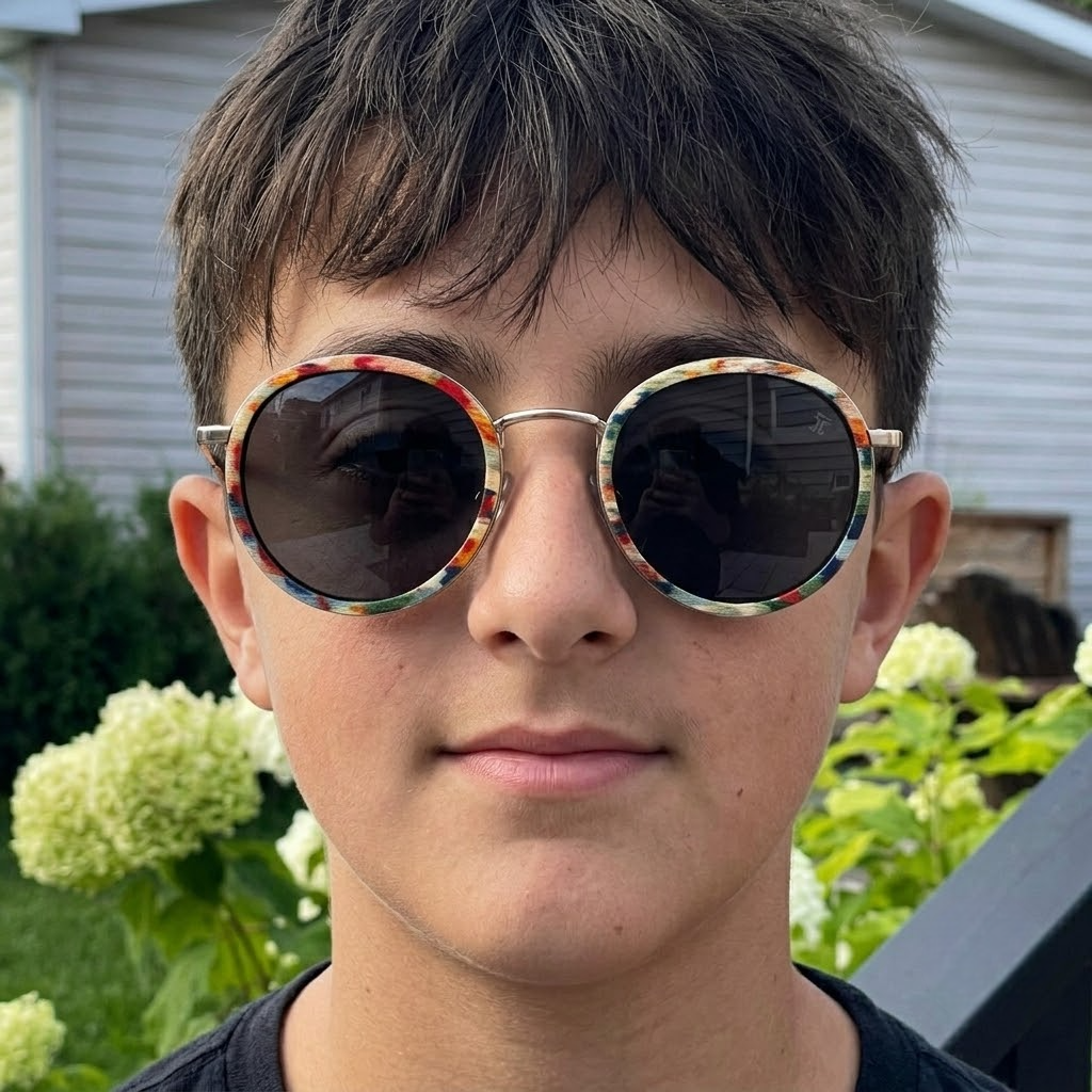 Kids round sunglasses on face with multicolor wood frame and dark lenses