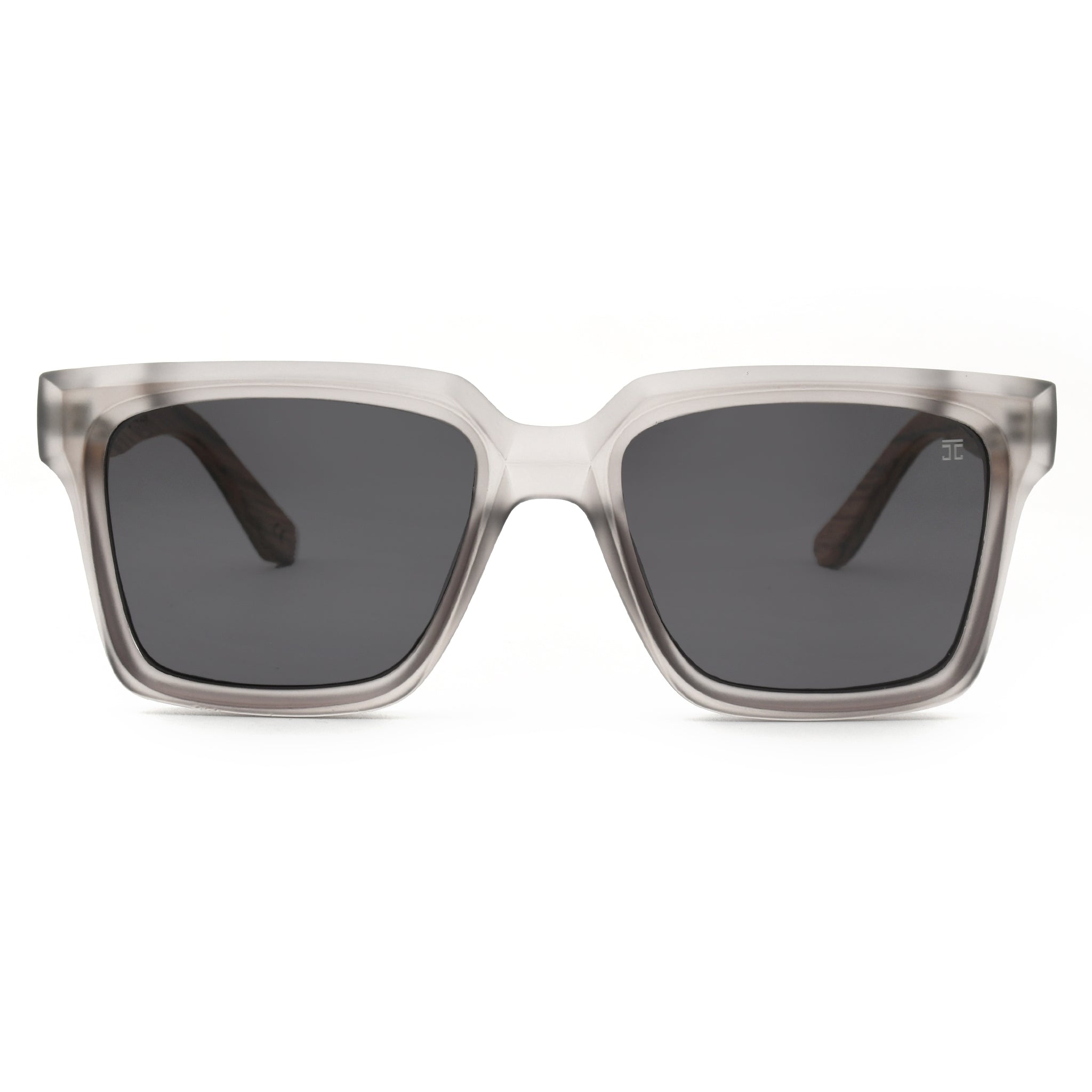 Oversized sunglasses with translucent light frame and dark lenses.