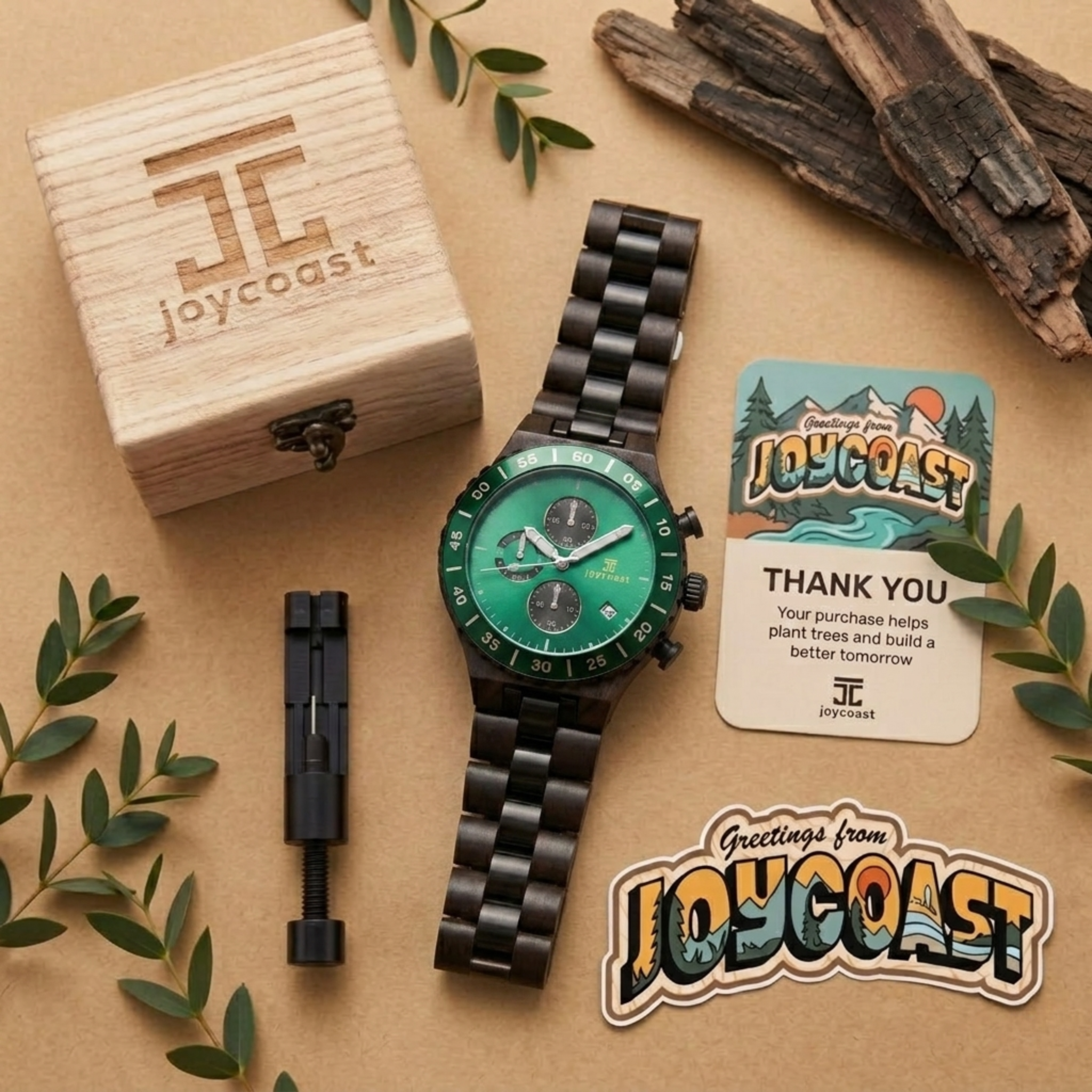 Chronograph watch with green dial and black metal bracelet in flat lay