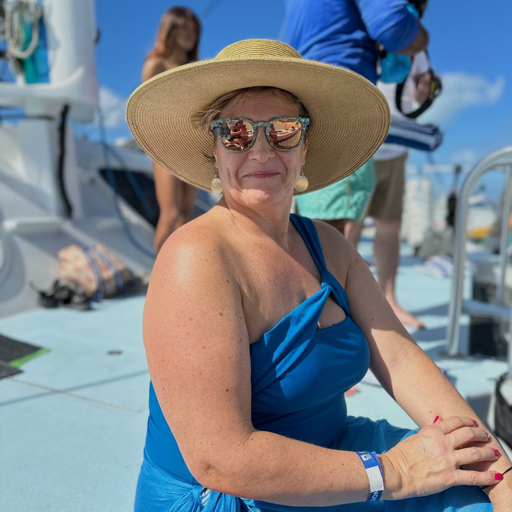 Adult Woman Wearing Har and Sunglasses made from Wood and Abalone Sea Shell