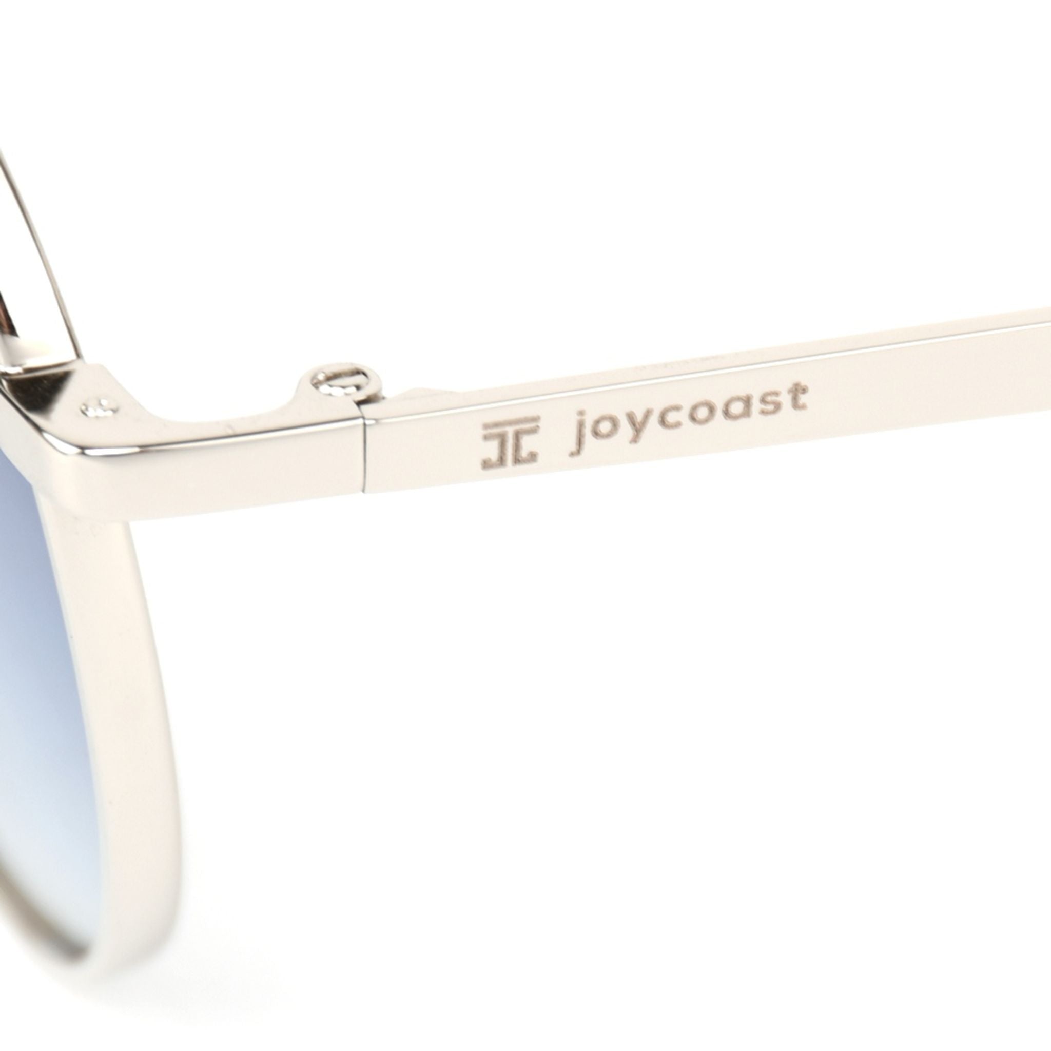 Cat-eye sunglasses arm with joycoast logo on silver metal frame
