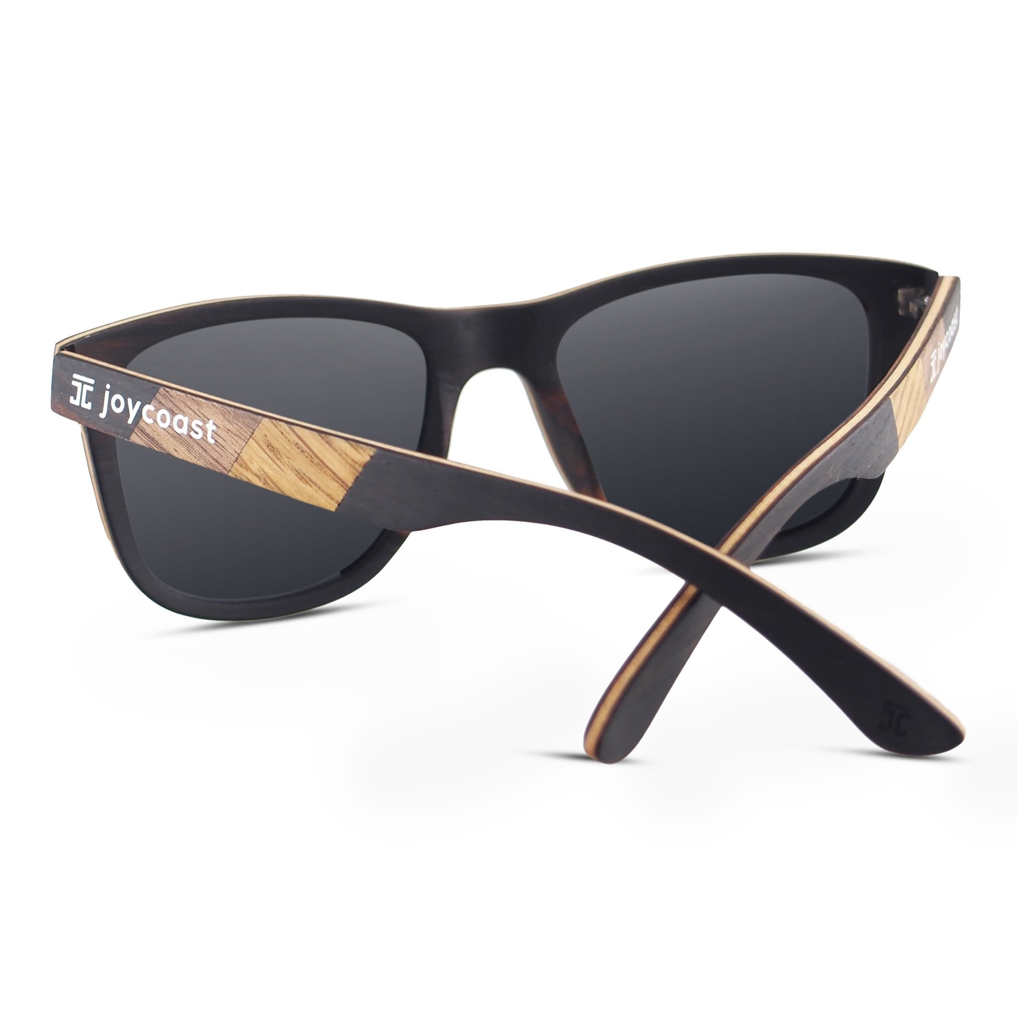 Sunglasses with dark lenses, zebrawood inlay temples, and ebony frame