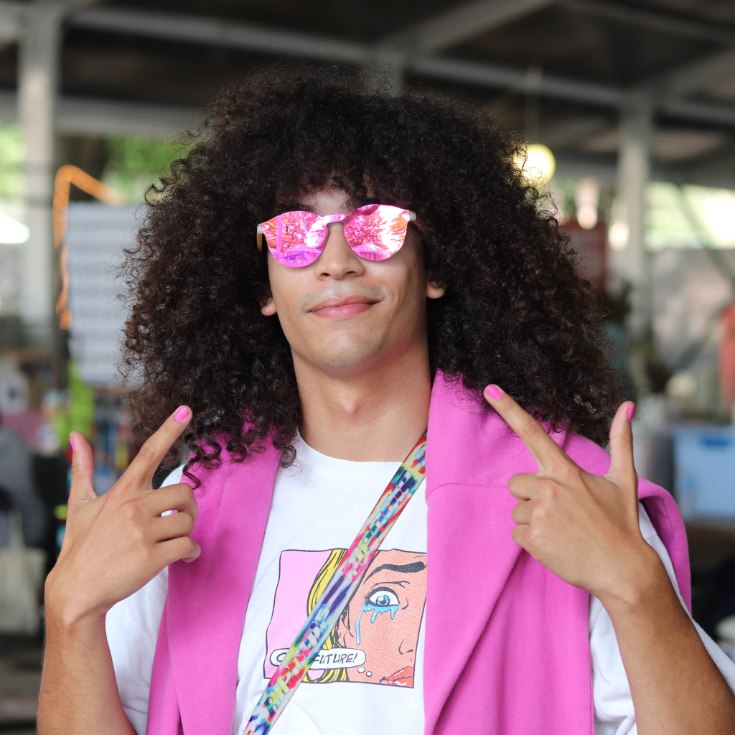 Round sunglasses with pink lenses and pink frame.