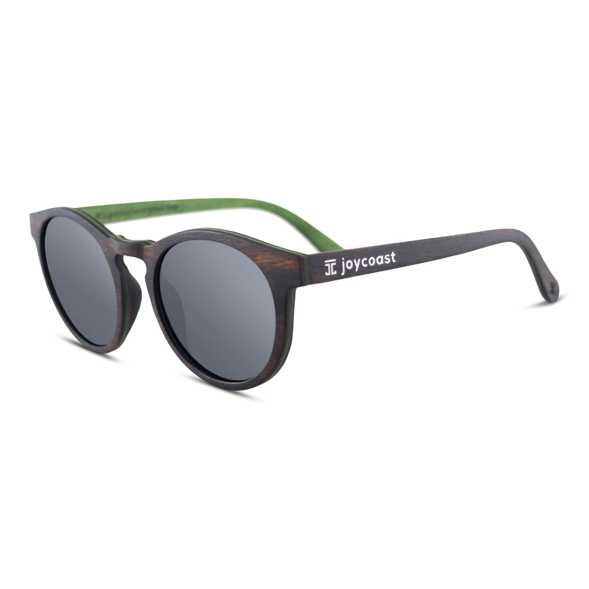 Round wooden sunglasses with dark frame, green temples, and joycoast logo