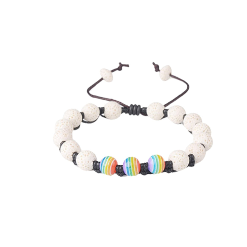 Beaded pride bracelet with white textured beads and rainbow striped center beads