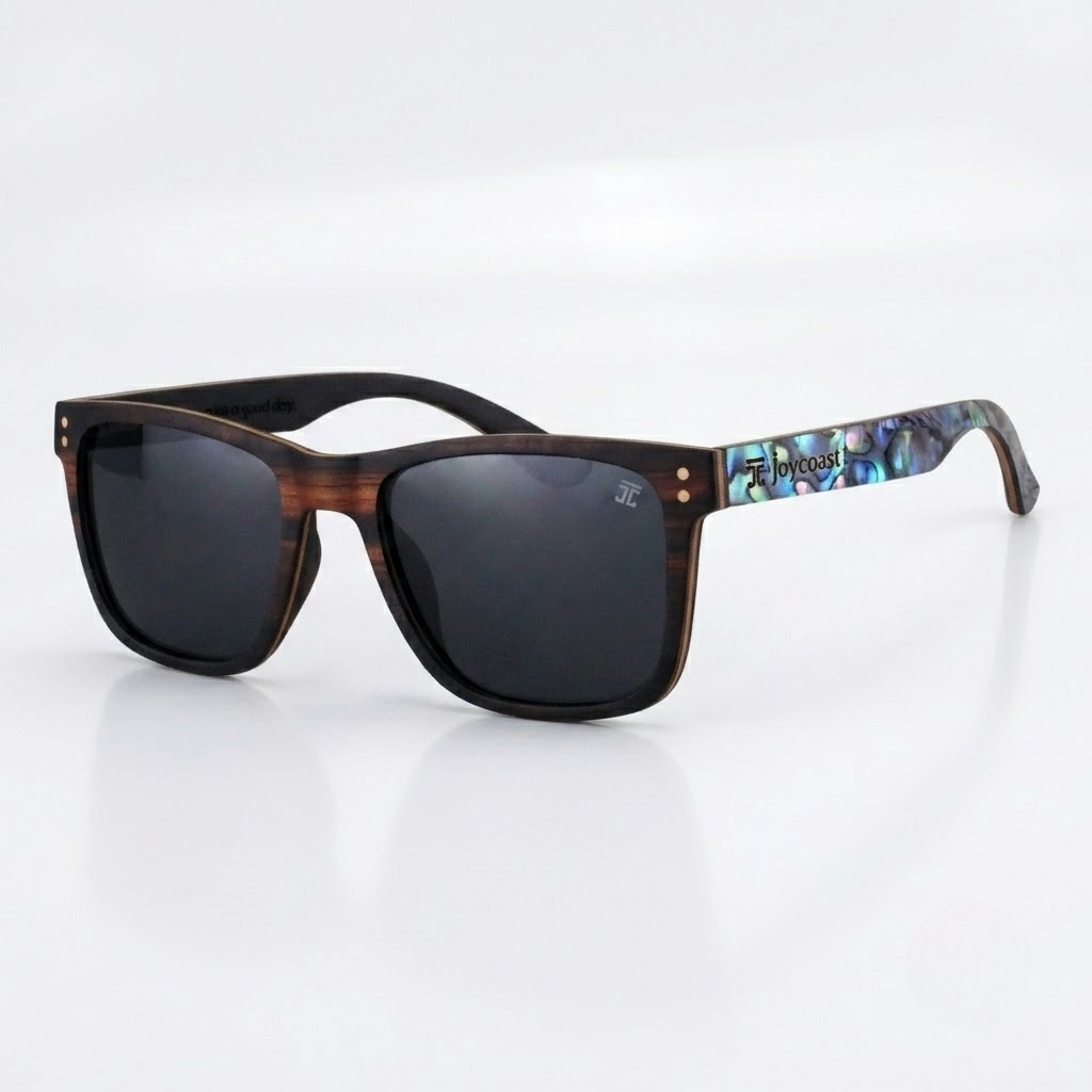 Side view of ebony wood sunglasses with dark lenses and iridescent abalone-pattern temple
