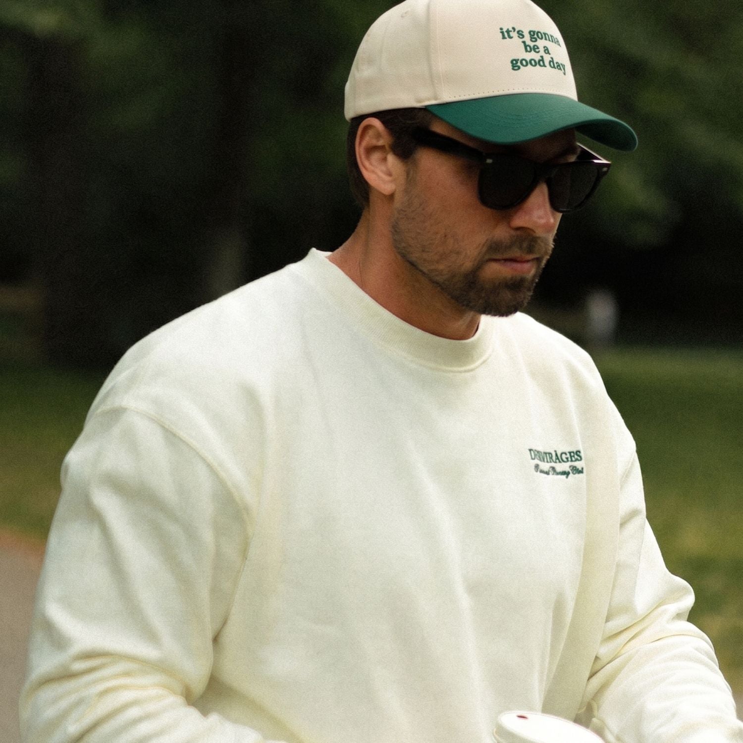 Green and cream baseball cap with “it’s gonna be a good day” front text