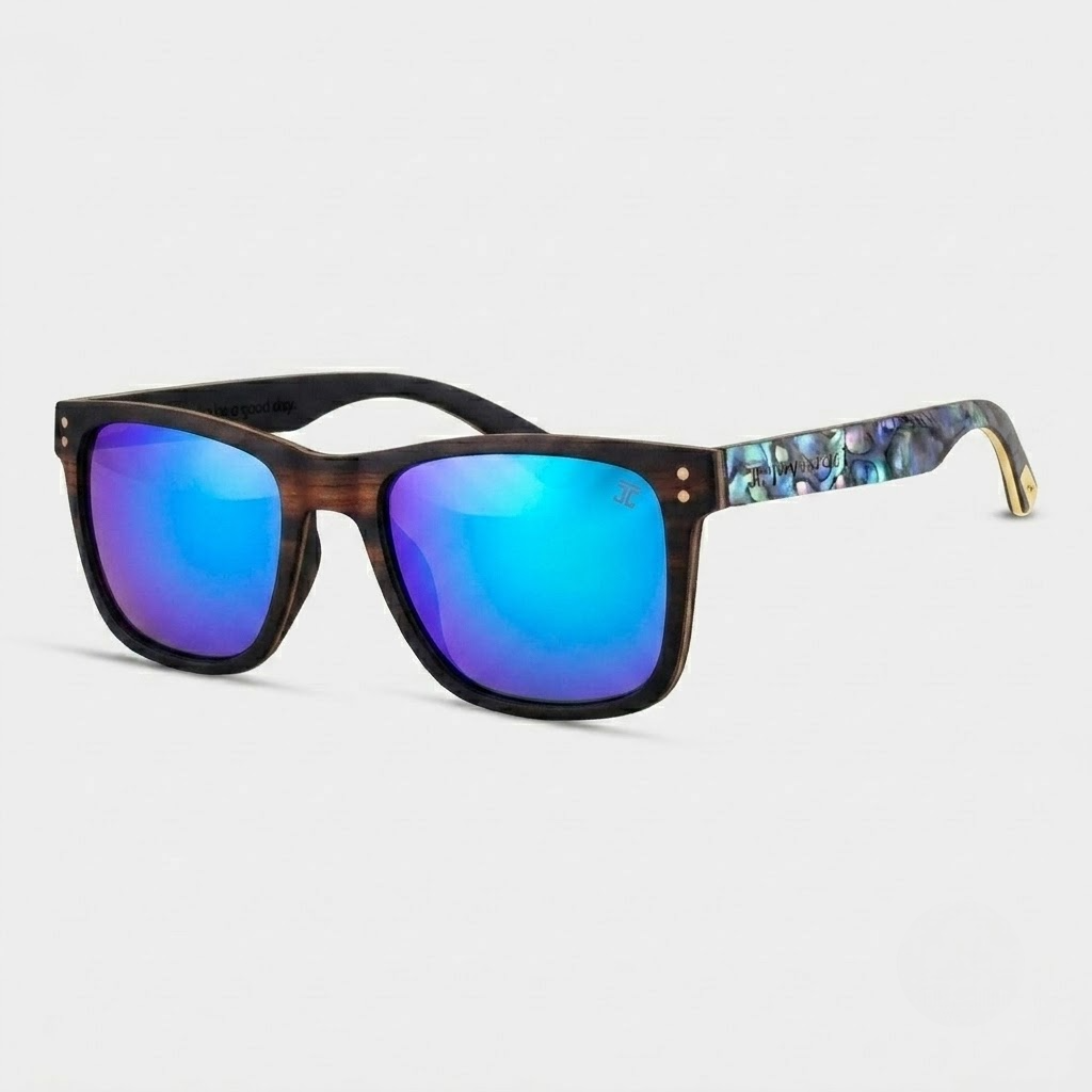 Sunglasses with blue reflective lenses and a patterned arm on a light gray background