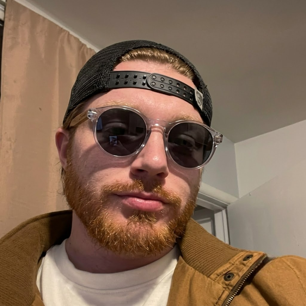 Round sunglasses on a face with dark lenses and wooden arms