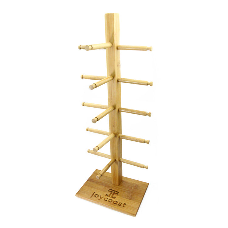 Bamboo sunglasses stand with vertical frame, four side pegs, and Joycoast logo base