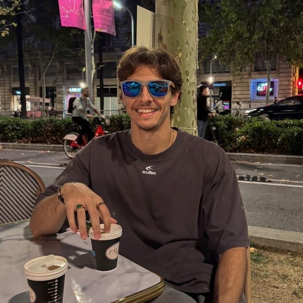 Wooden sunglasses on a person, with blue mirrored lenses and zebrawood arms