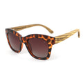 Oversized tortoise sunglasses with dark lenses and wood temple arms