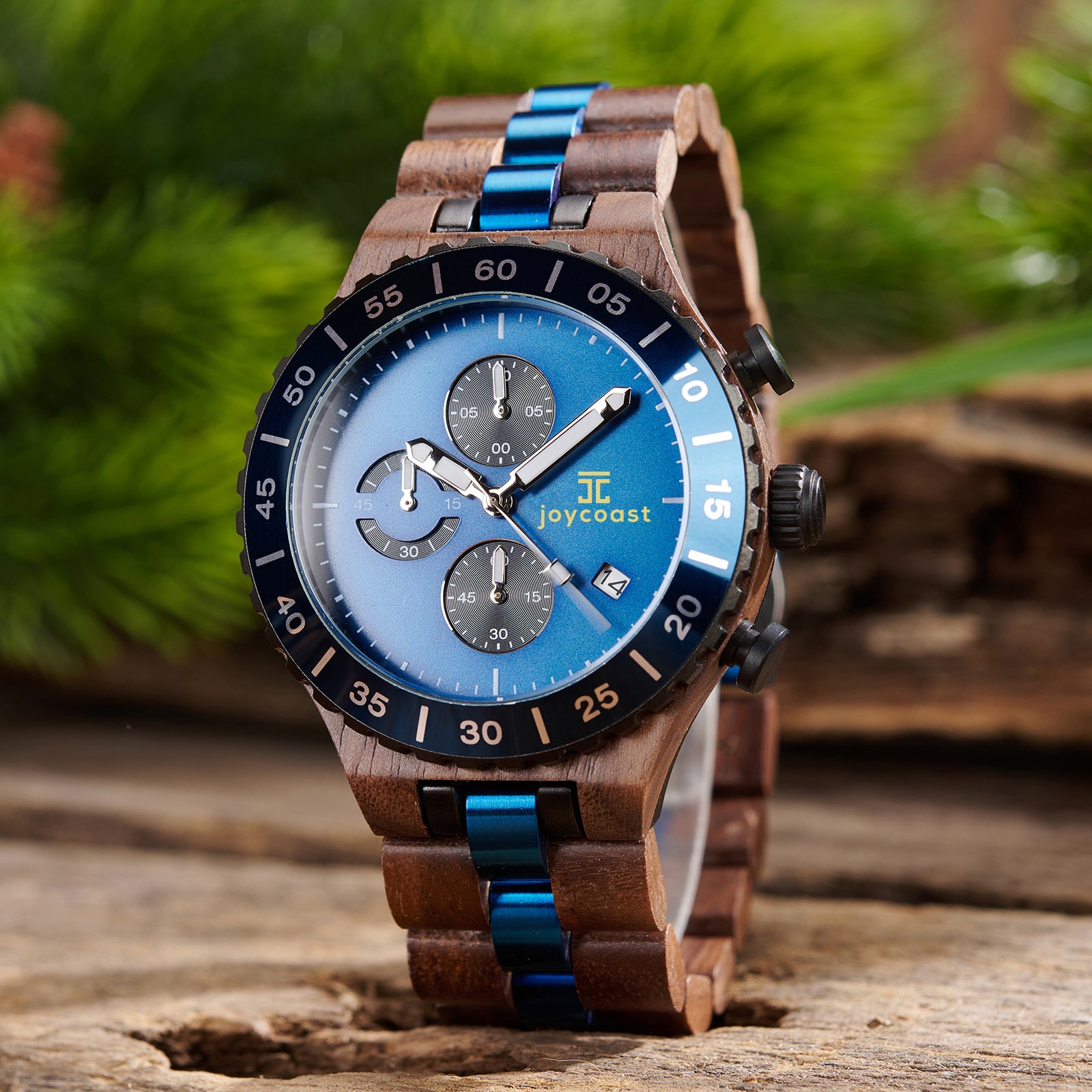 Joycoast wooden watch with light blue face and two-tone band, angled to show the side.