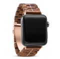 Walnut wooden Apple Watch band with rose gold-toned metal accents and adjustable clasp