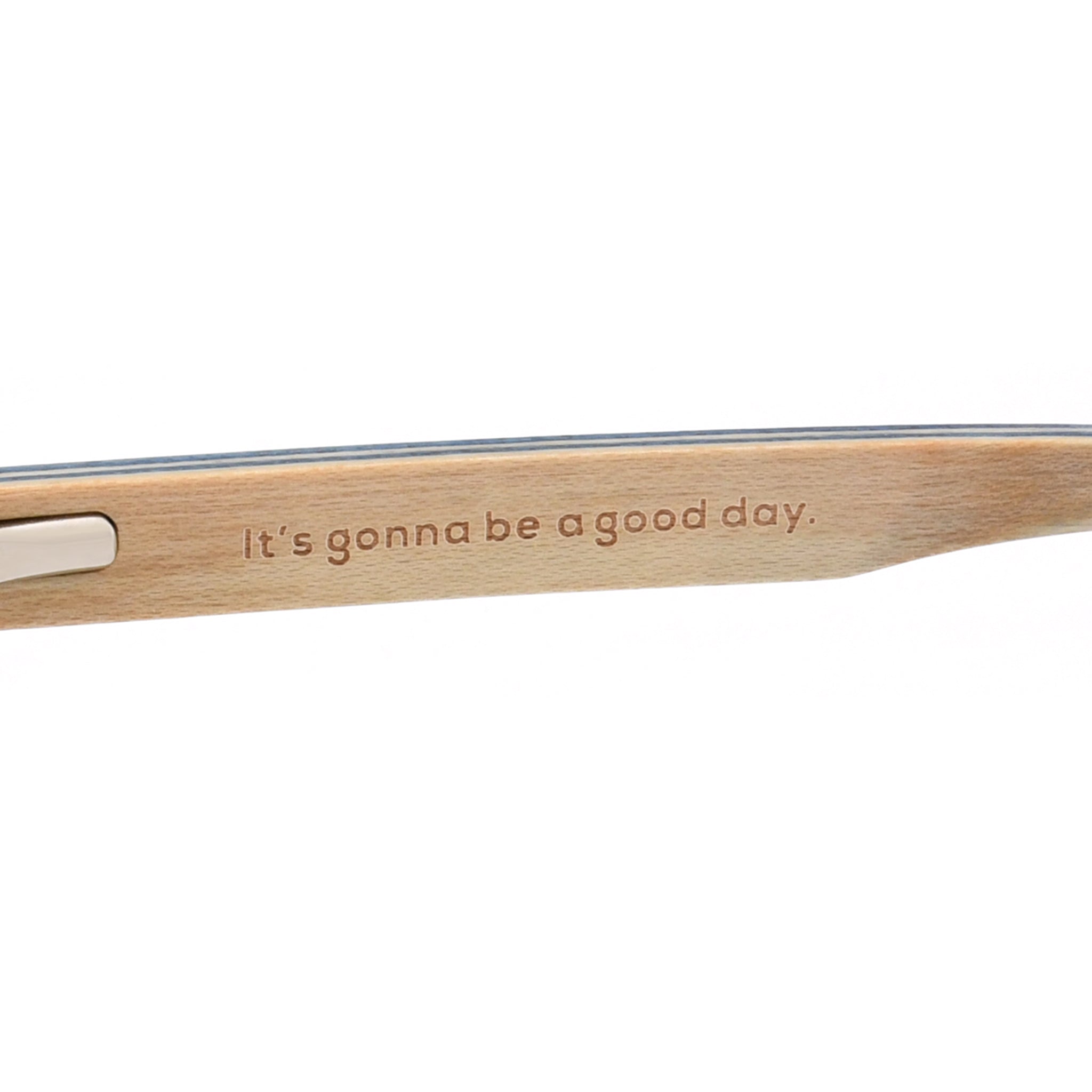 Wood temple arm on reading glasses with a slim cutout and printed text
