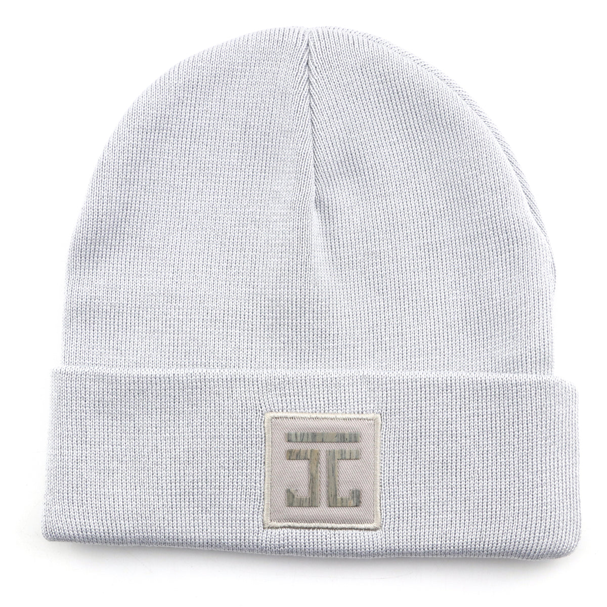 White knit beanie with square logo patch on the front cuff