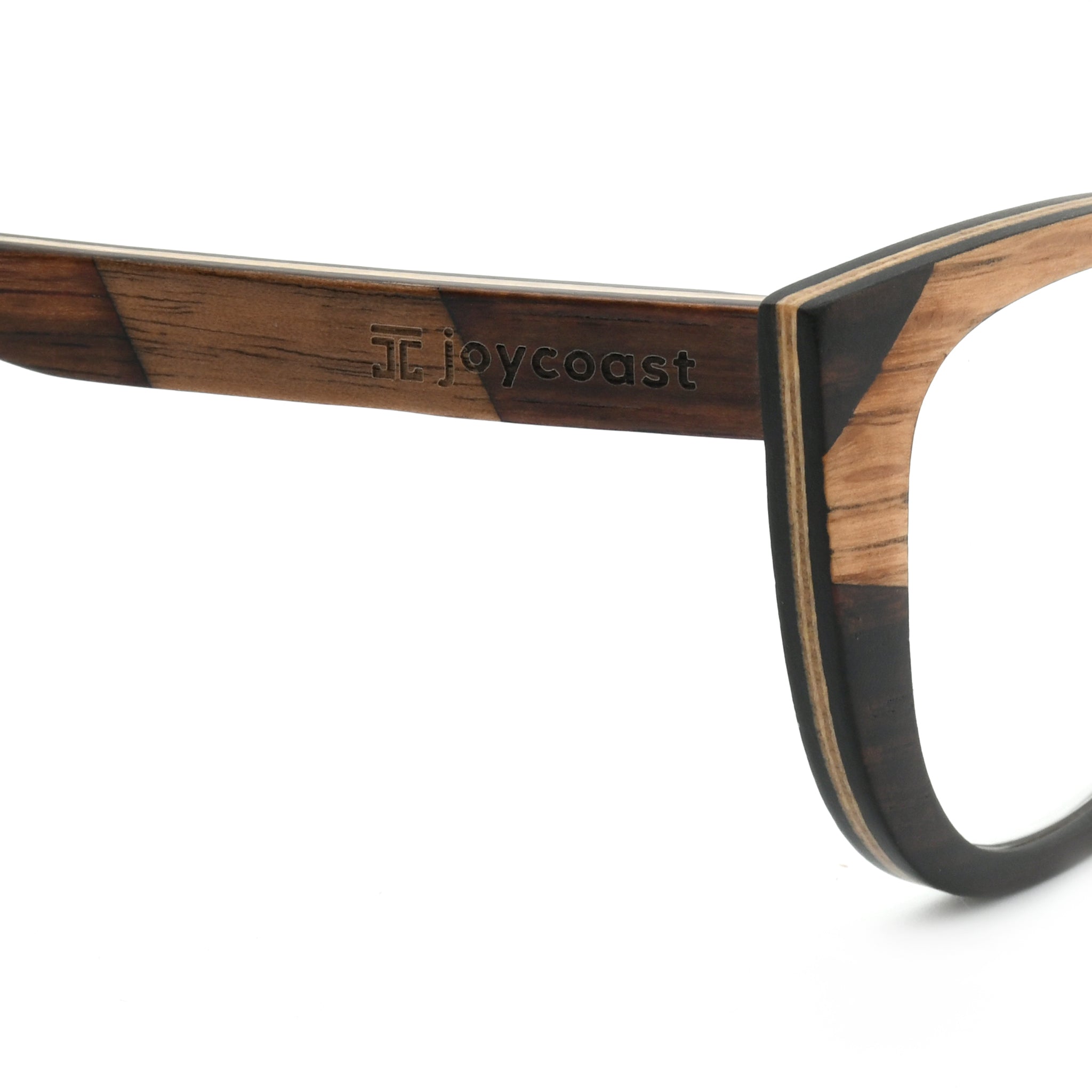 Wooden reading glasses, right temple close-up with brand engraving and dark frame edge.