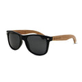 Sunglasses with black frames and wooden arms on a white background