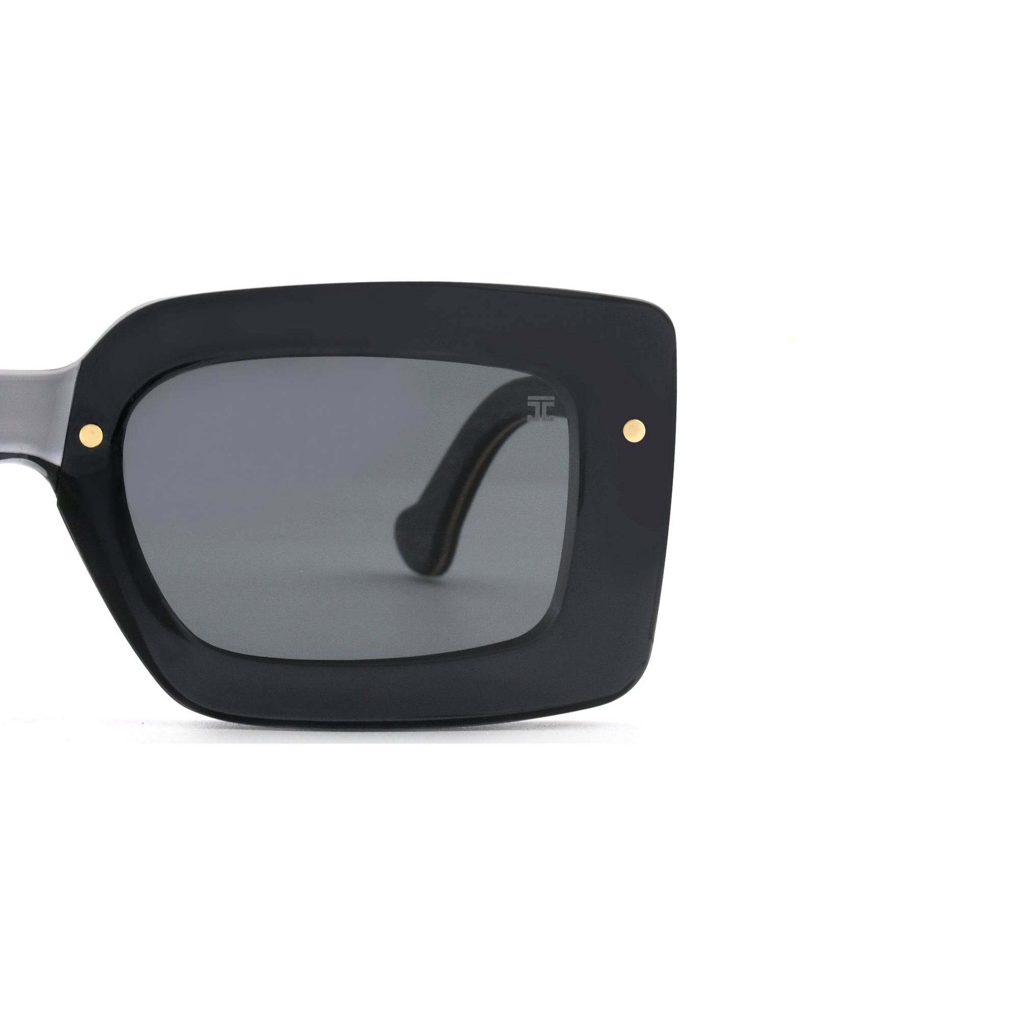 Partial view of Joycoast black wooden square sunglasses with dark lenses and wooden arm.