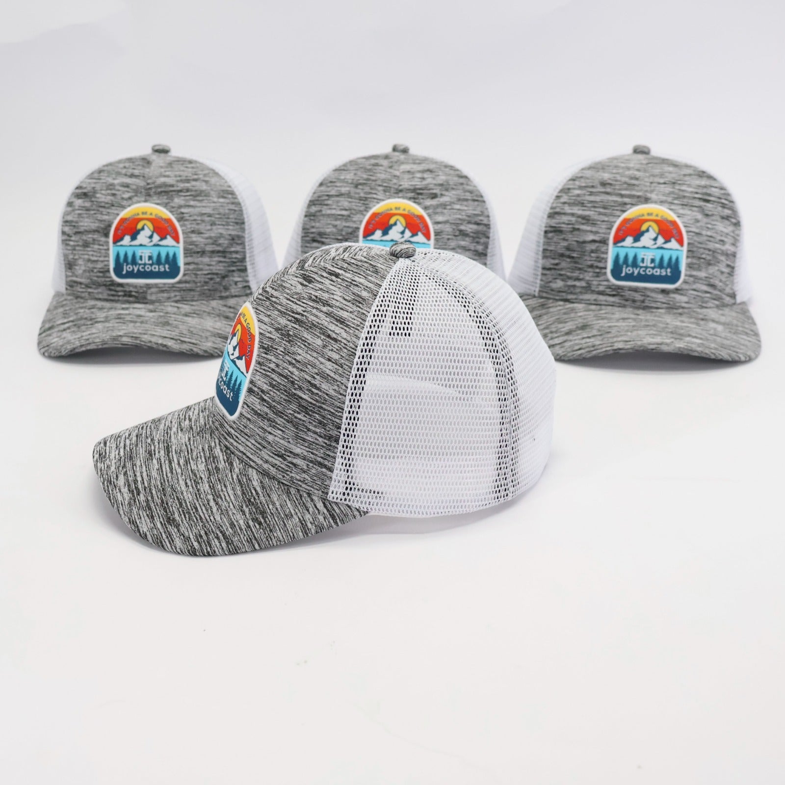 Heather gray baseball cap with white mesh back and Joycoast logo front patch, angled view