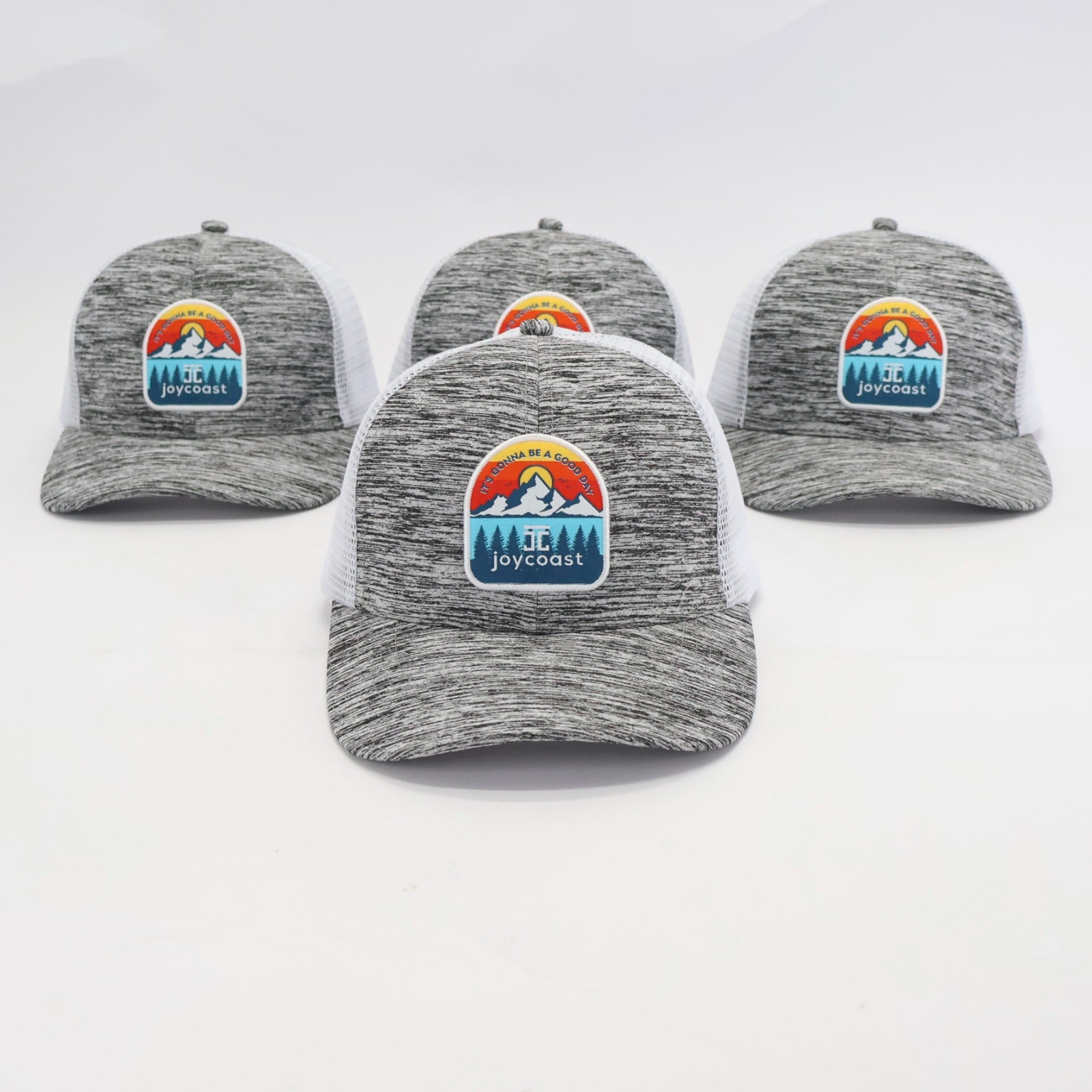 Three heather gray baseball caps with white mesh backs and Joycoast logo front patches