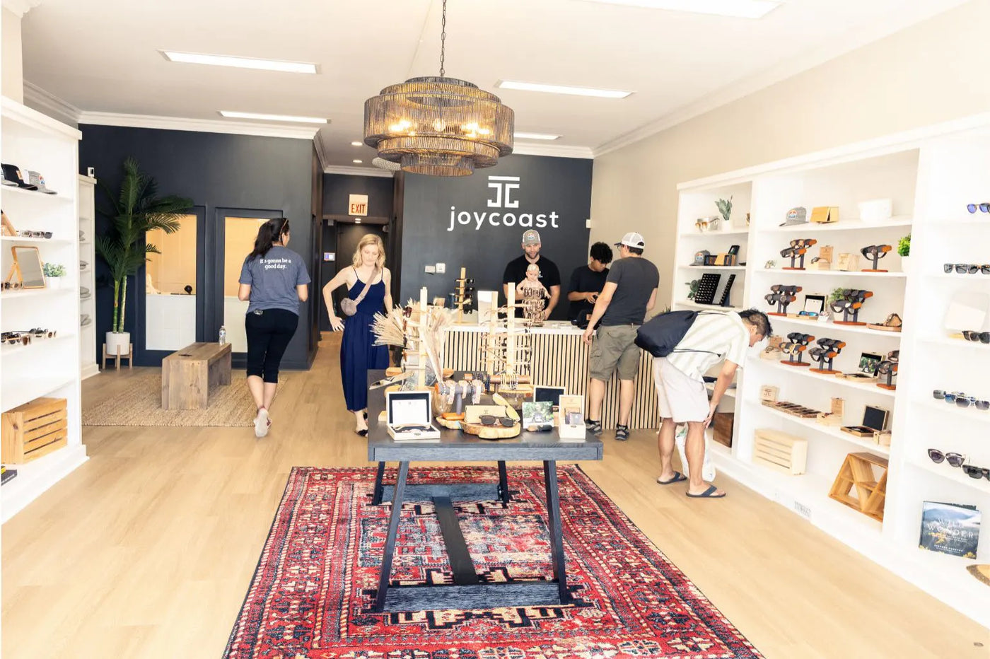 Shoppers browse aisles filled with various products in a well-stocked store.