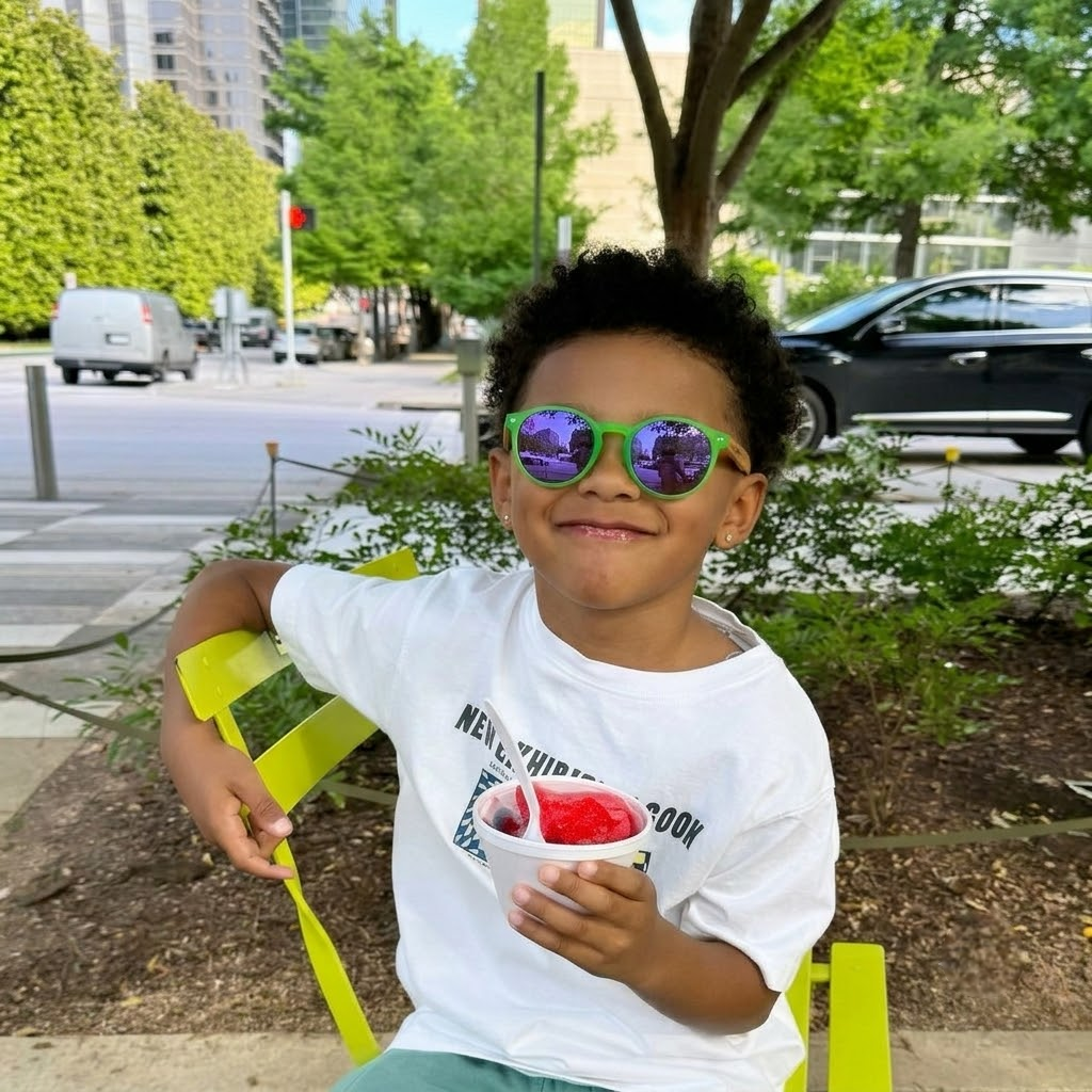 Kids wooden sunglasses on child: green frame with purple-blue tinted lenses