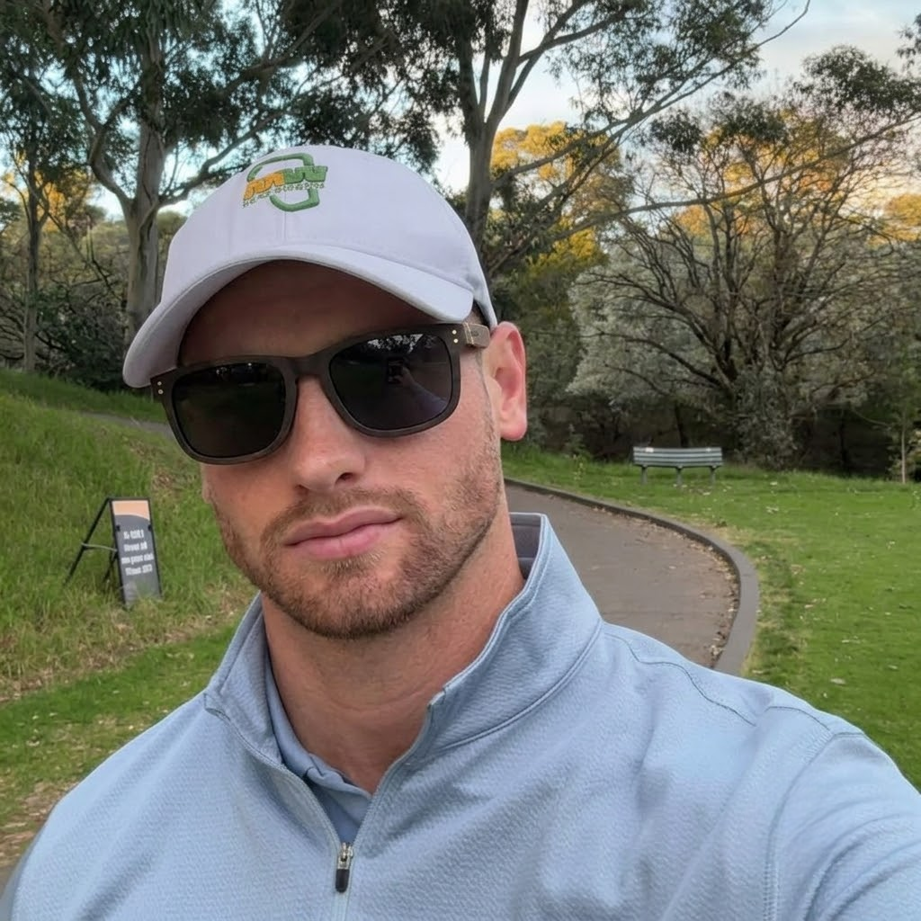 Dark wayfarer sunglasses worn with wood-toned temples and protective lenses