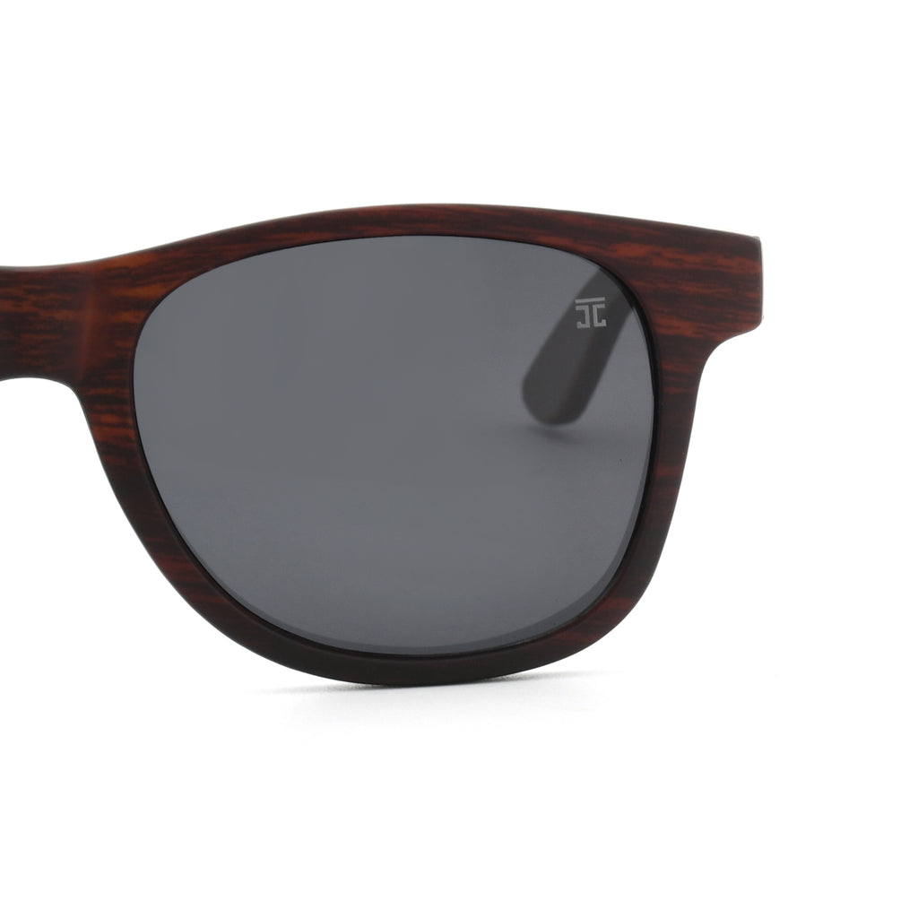 Brown wood sunglasses with large dark mirrored lenses, curved acetate-style edges