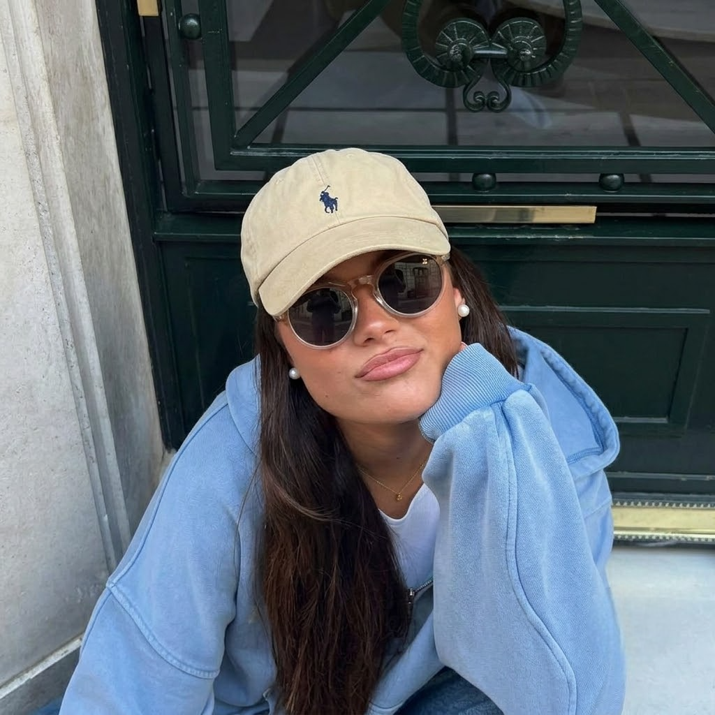 Wooden round sunglasses with dark lenses and rosewood arms, on model wearing them
