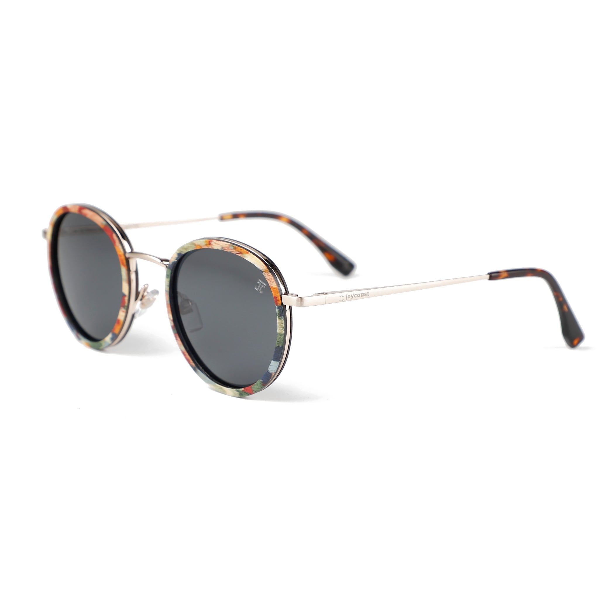 Kids round sunglasses, side view, multicolor patterned frame with dark gray lenses.