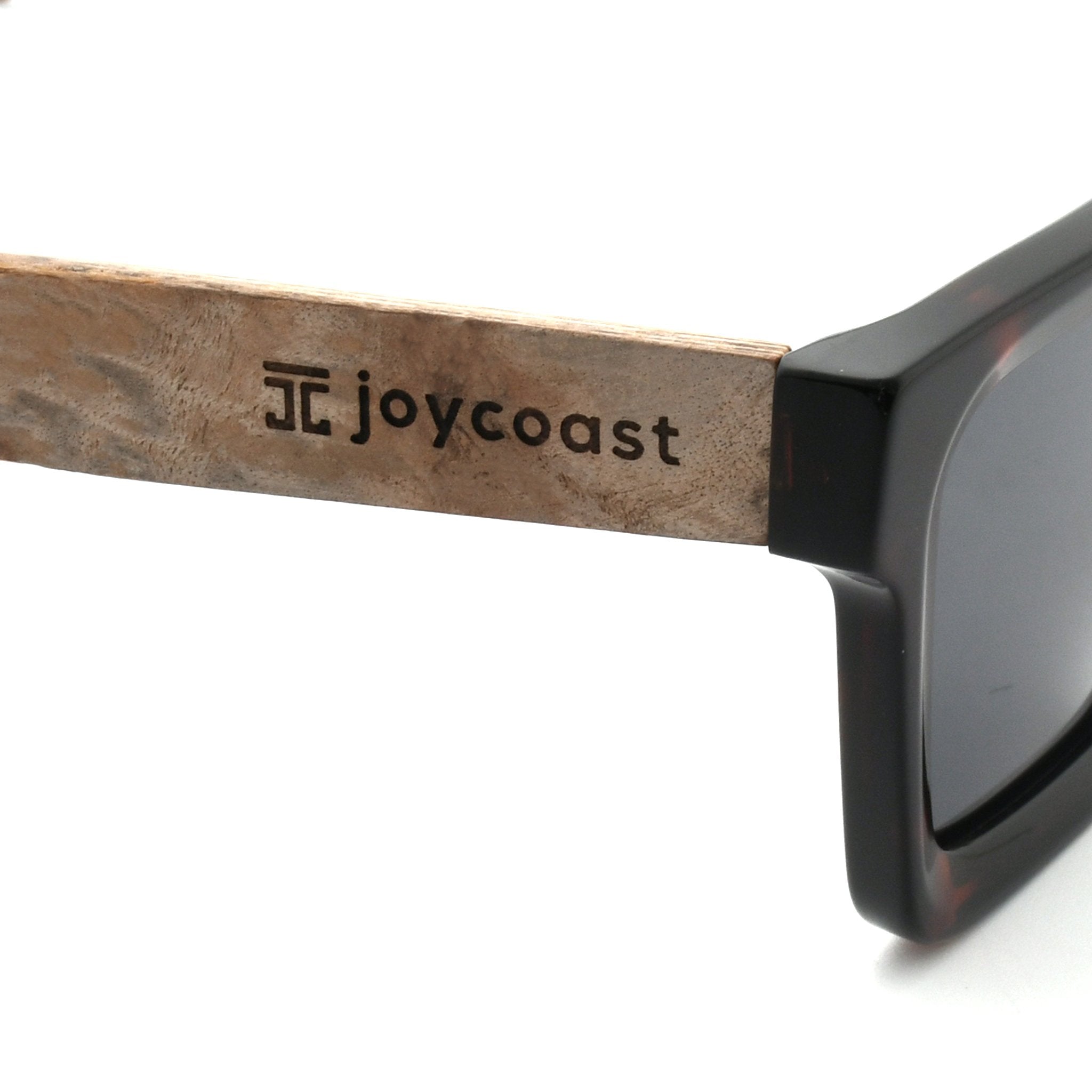 Joycoast logo on walnut wood temple with dark lens edge