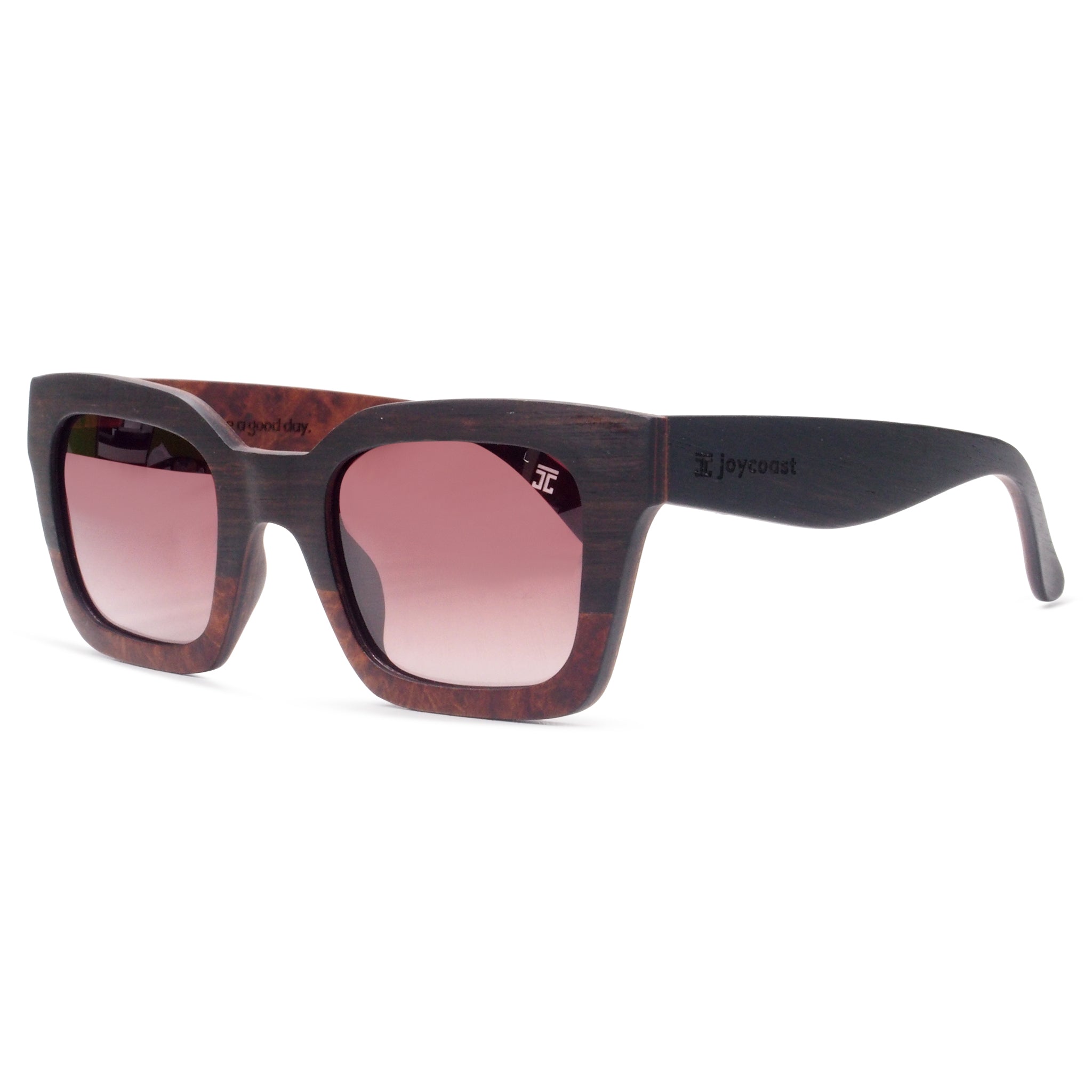 Kids sunglasses, dark wood-look frame, pink tinted lenses; Joycoast logo on arm