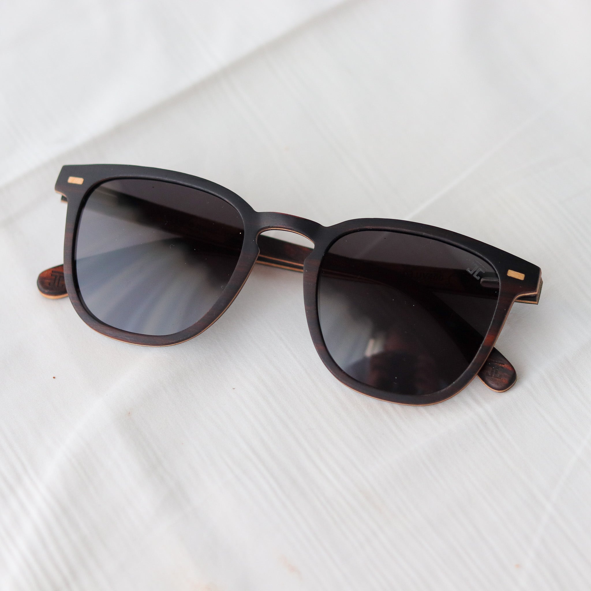 Cat-eye sunglasses with dark frames and gradient dark lenses