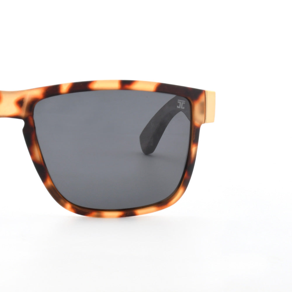 Tigers sunglasses close-up: tortoiseshell frame with dark oversized lenses