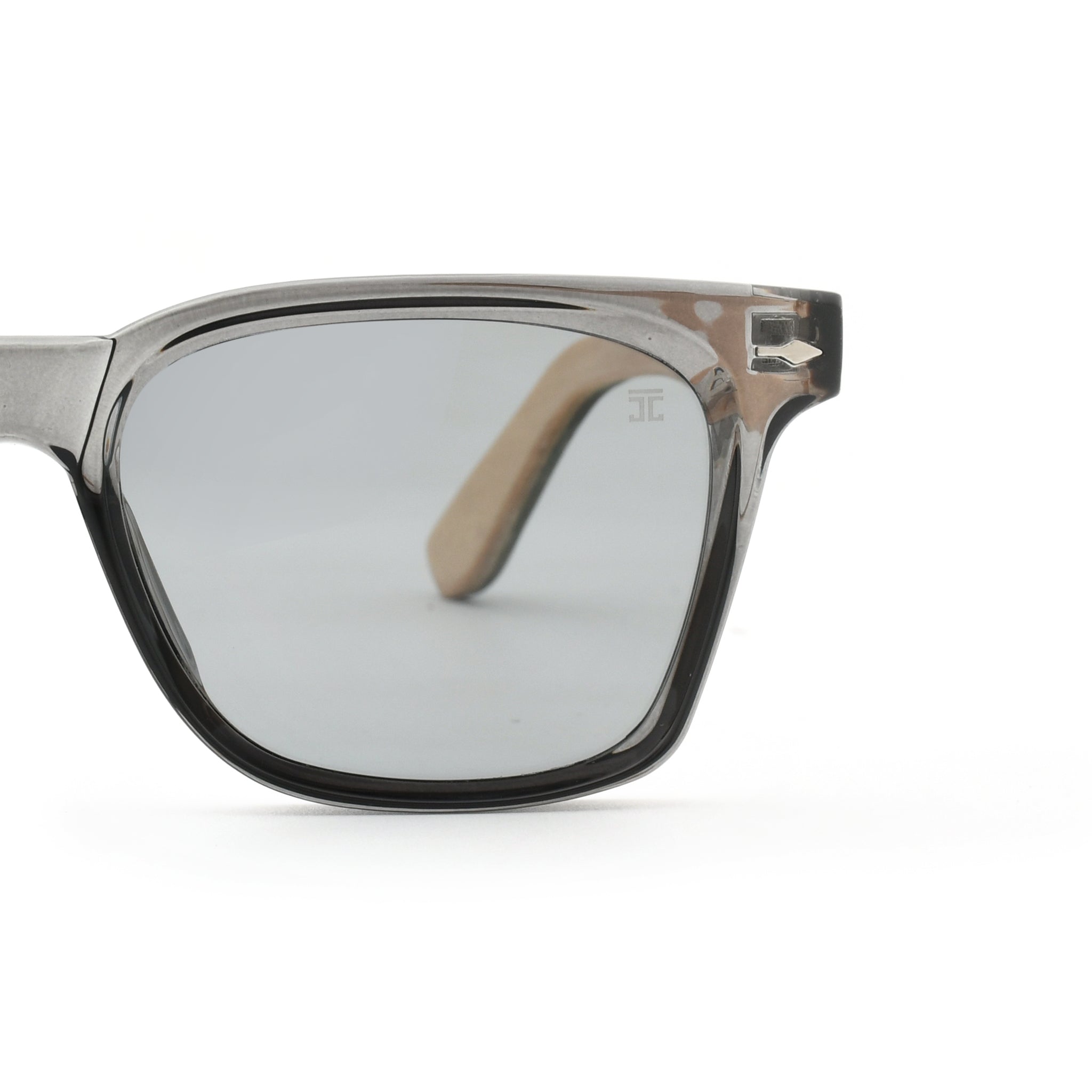 Kids square sunglasses close-up with light clear frame and pale gray lenses
