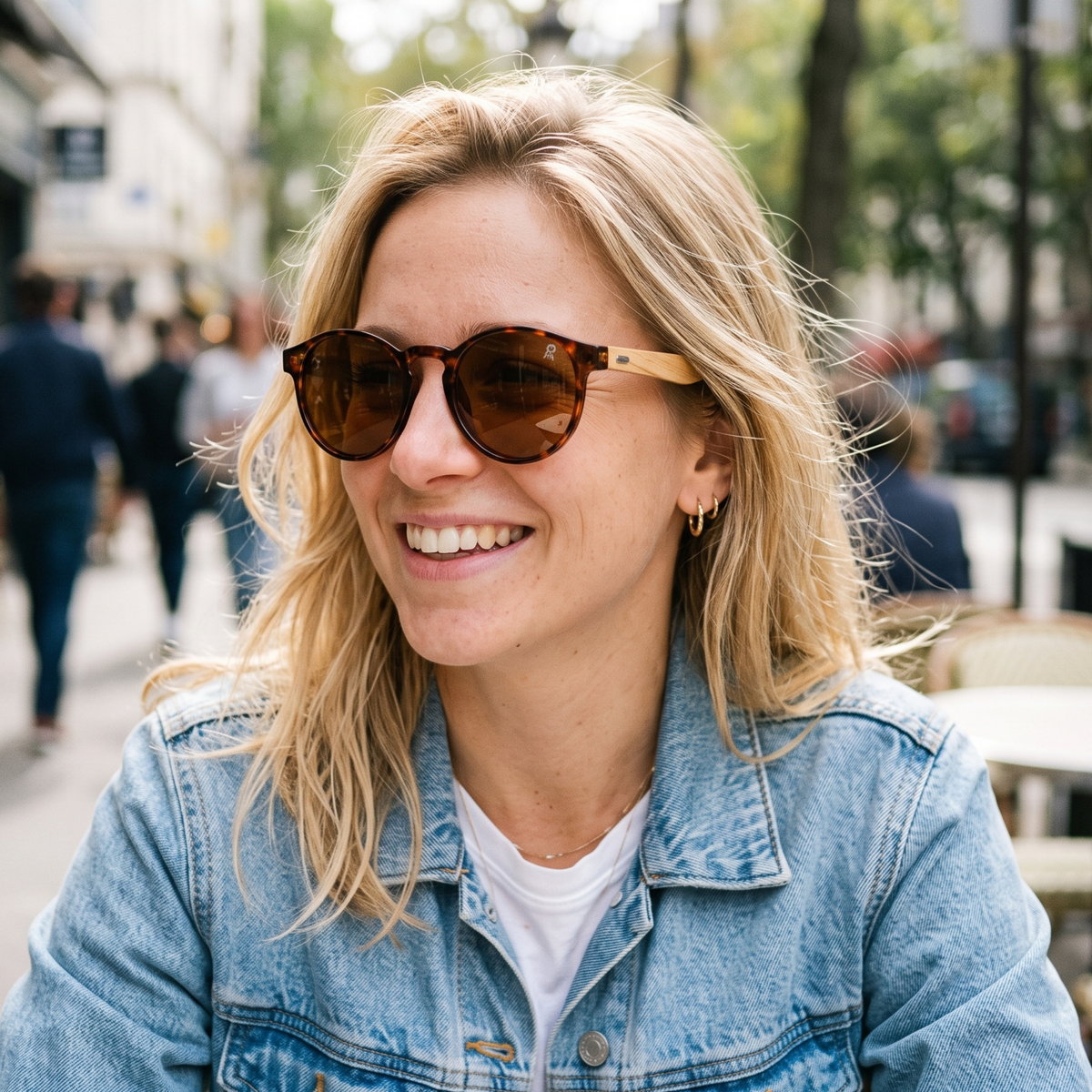 Round sunglasses with dark frame and brown-tinted lenses