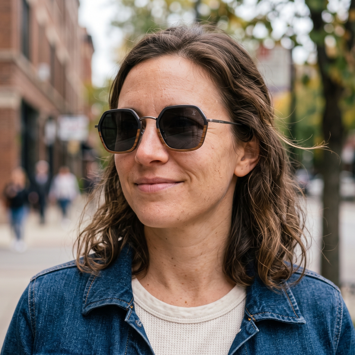 Ebony hexagon sunglasses with full black frames and dark lenses