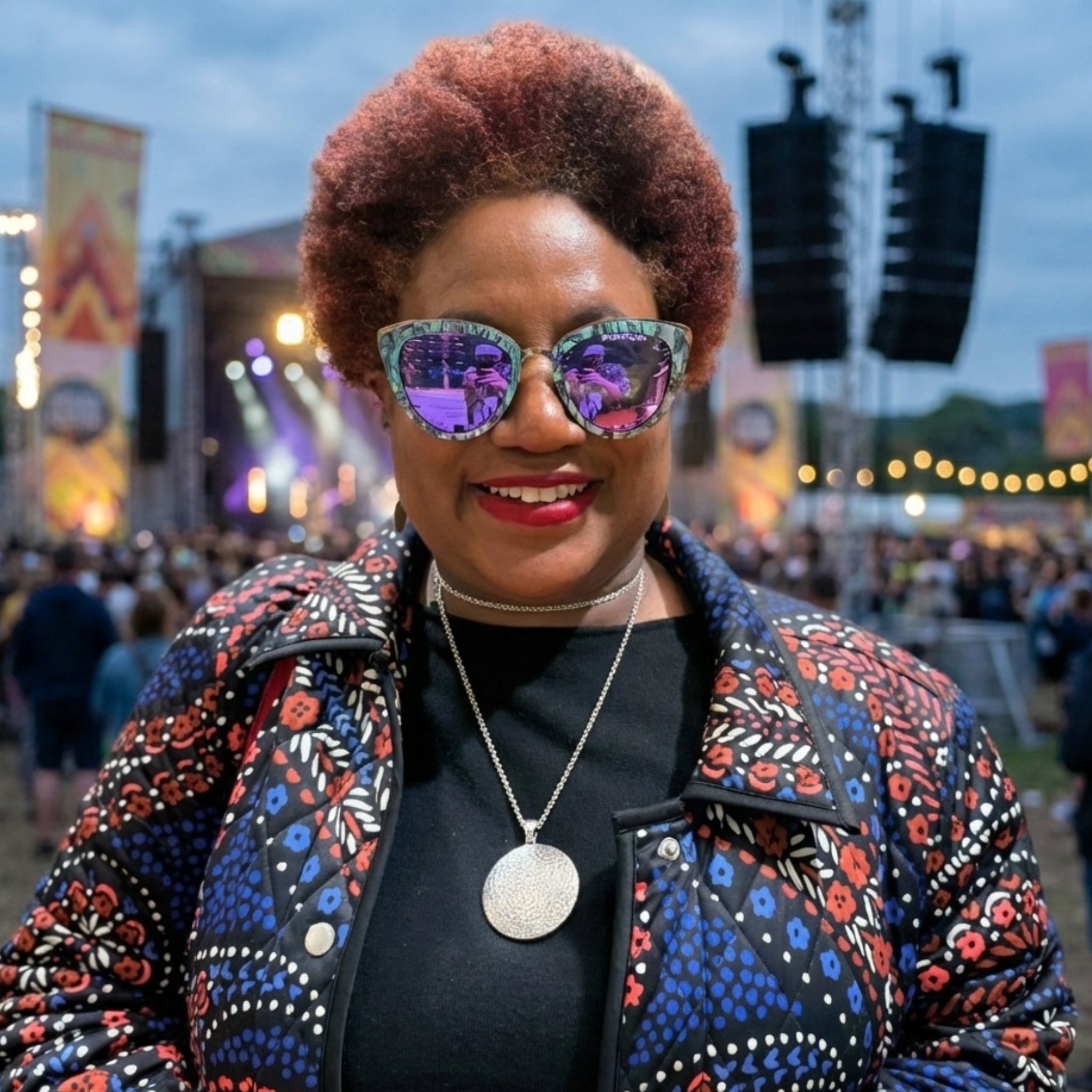 Cat-eye sunglasses with marbled blue-purple frames and reflective purple lenses