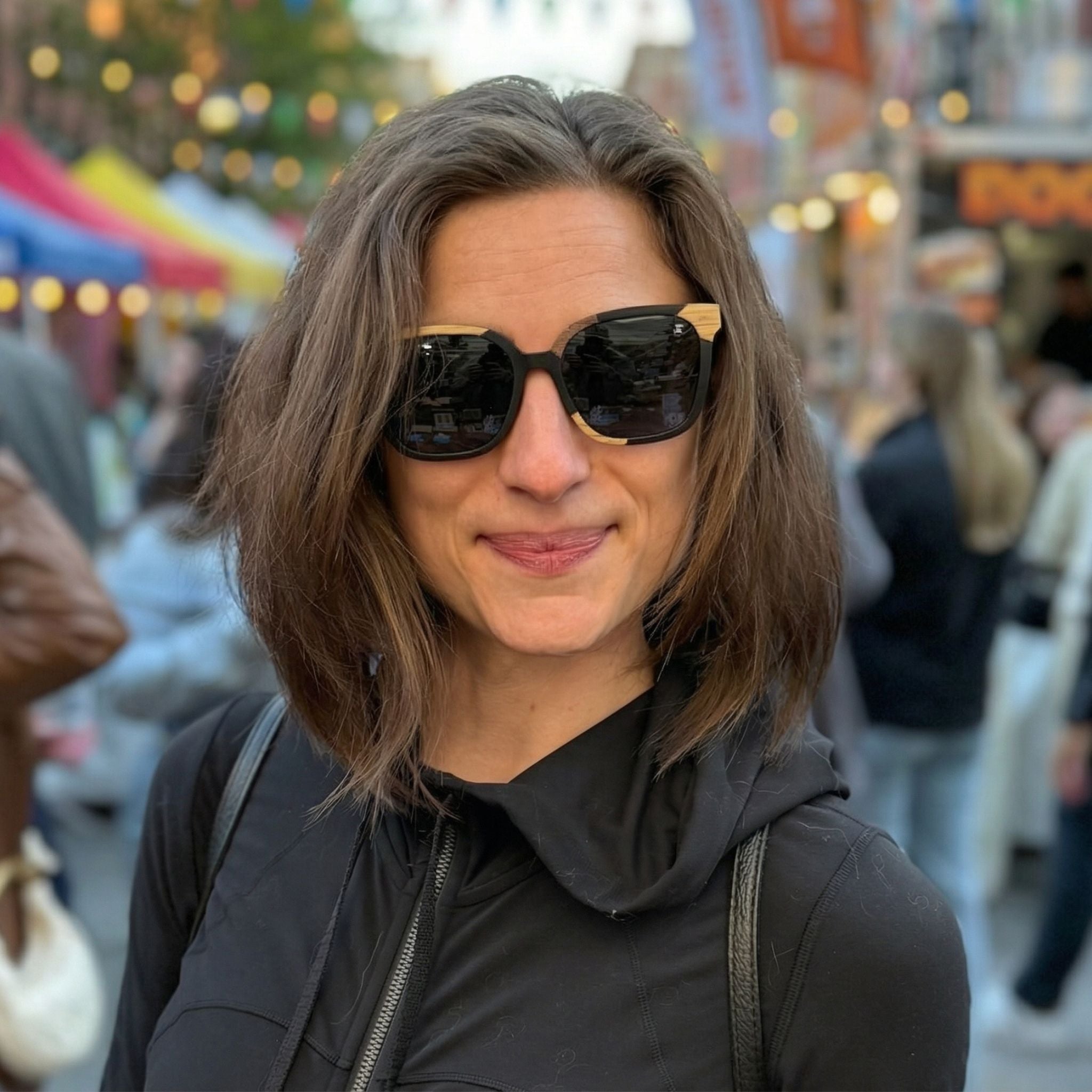 Woman smiling wearing mix wood sunglasses for street style